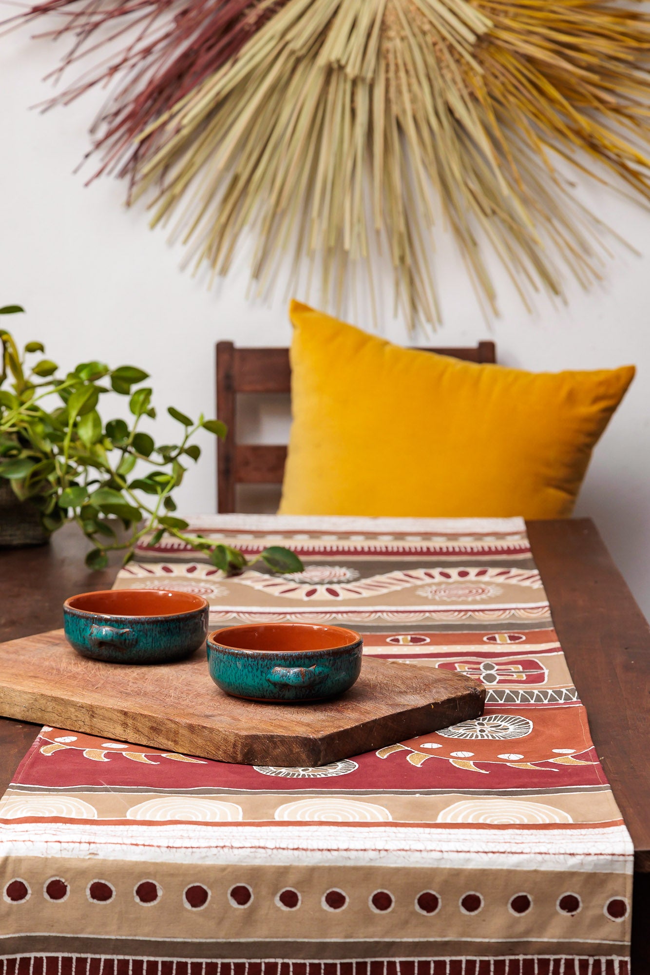 Detailed tribal print warm red and orange table runner, handcrafted.