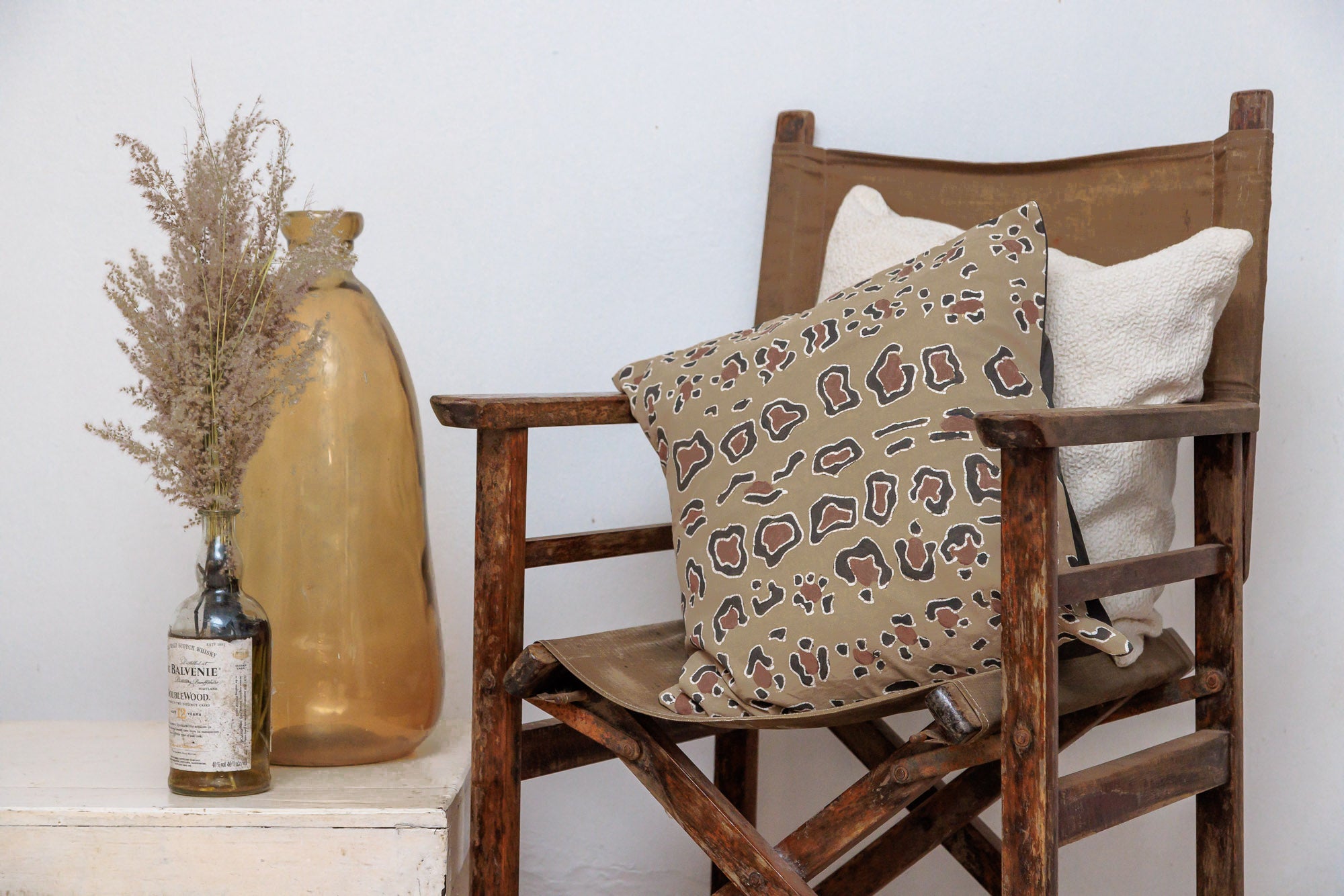 Eco-conscious cushion cover combining leopard print and batik, blending natural aesthetics with sustainable design