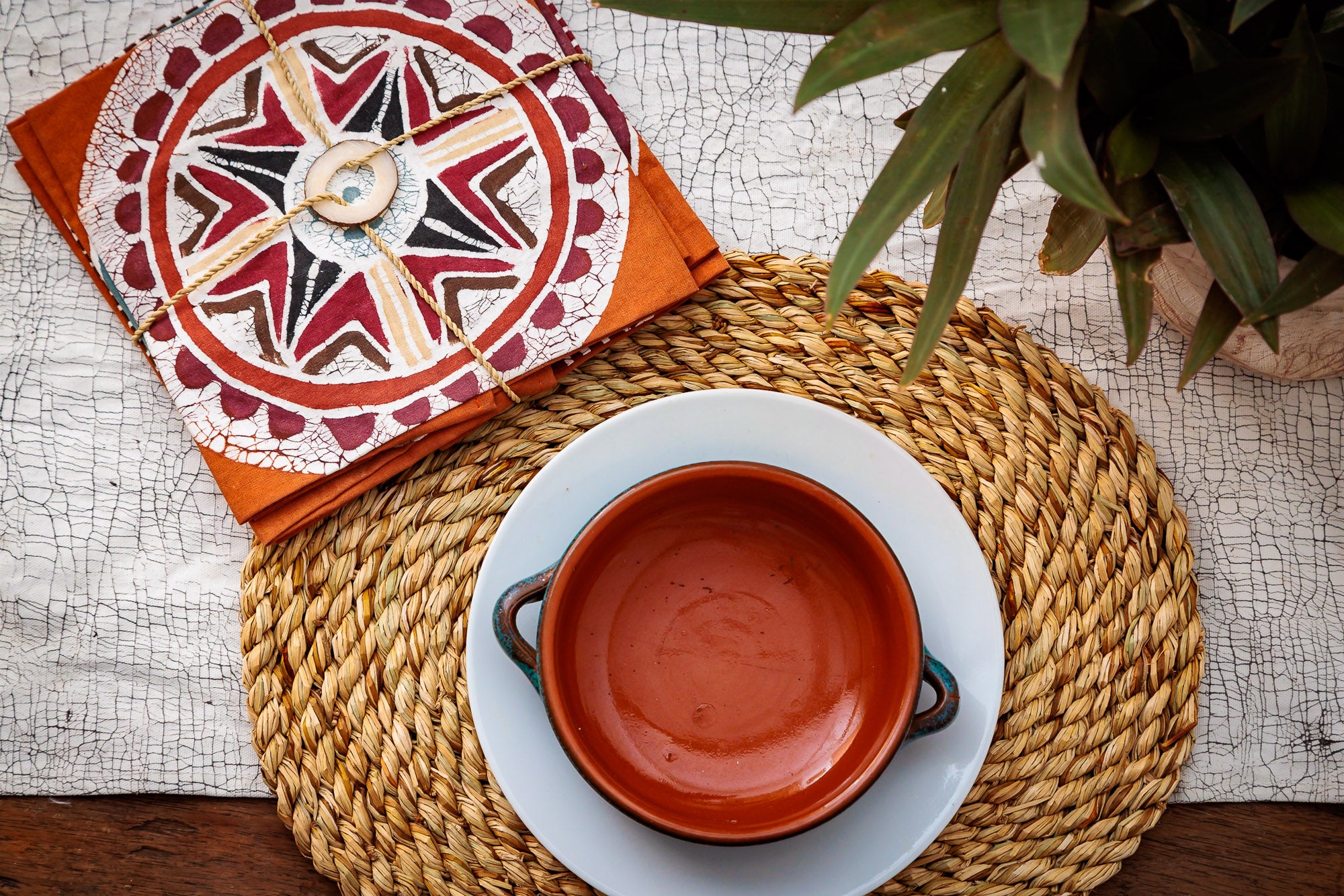 sustainable warm orange napkins with african circular patterns