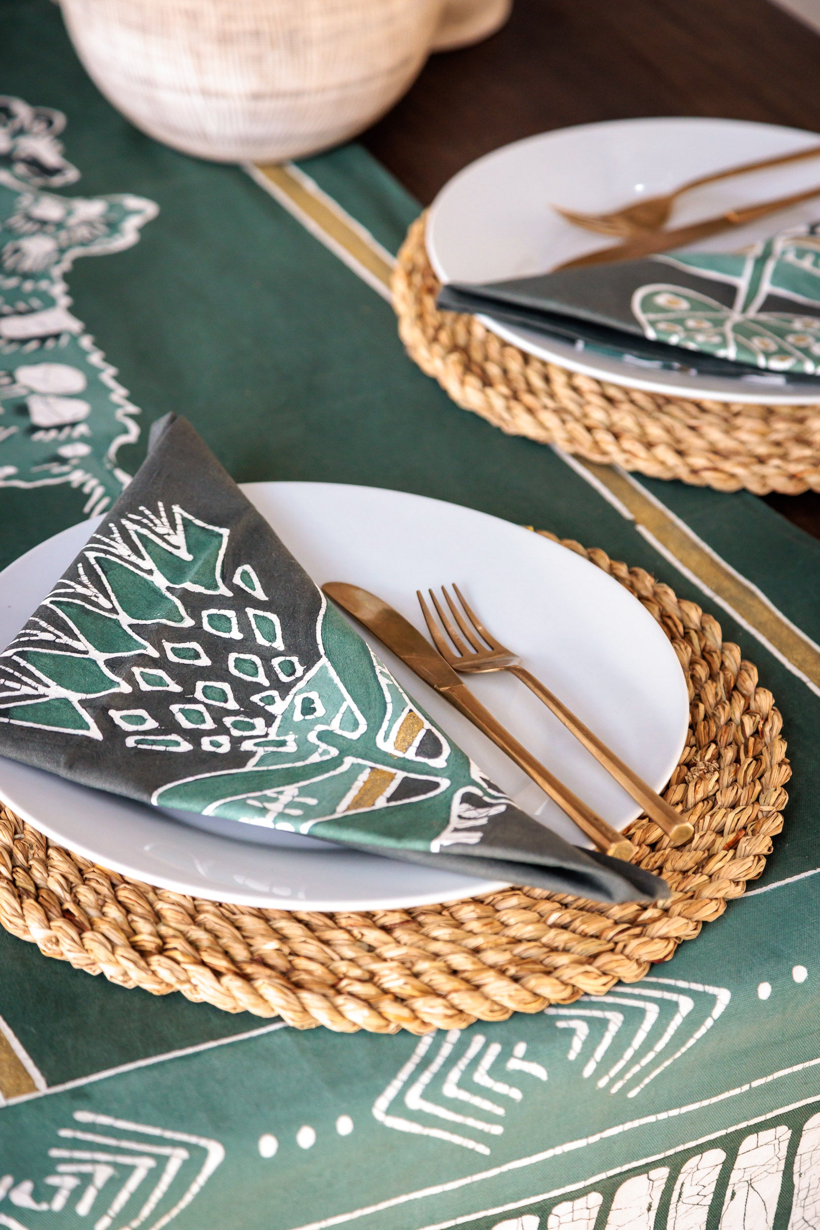 Green napkin set featuring graphic protea flower, hand painted batik made in Zambia