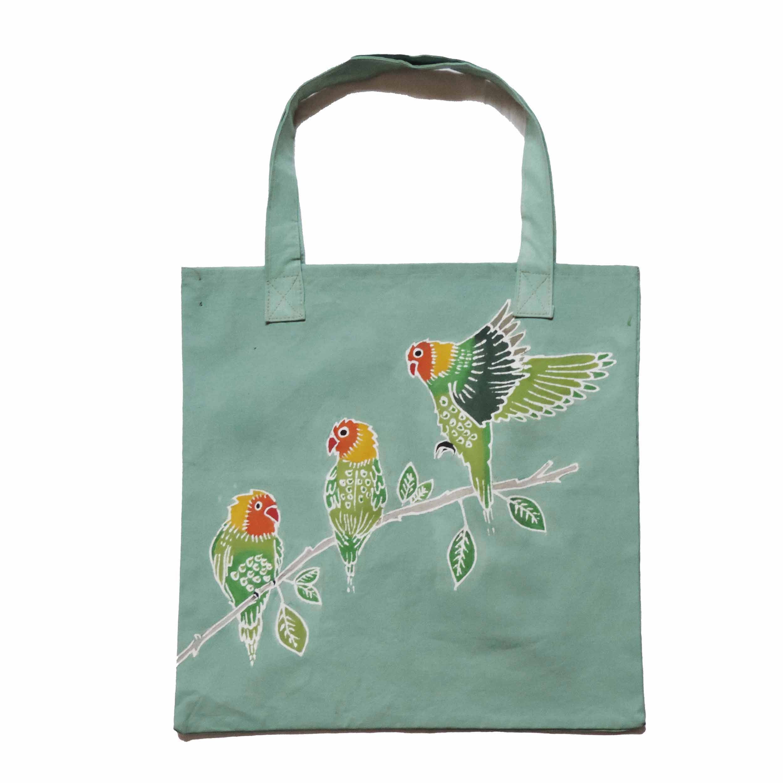 The perfect pale green tote bag, adorned with colourful lovebirds, the gift for all eco-conscious nature lovers.