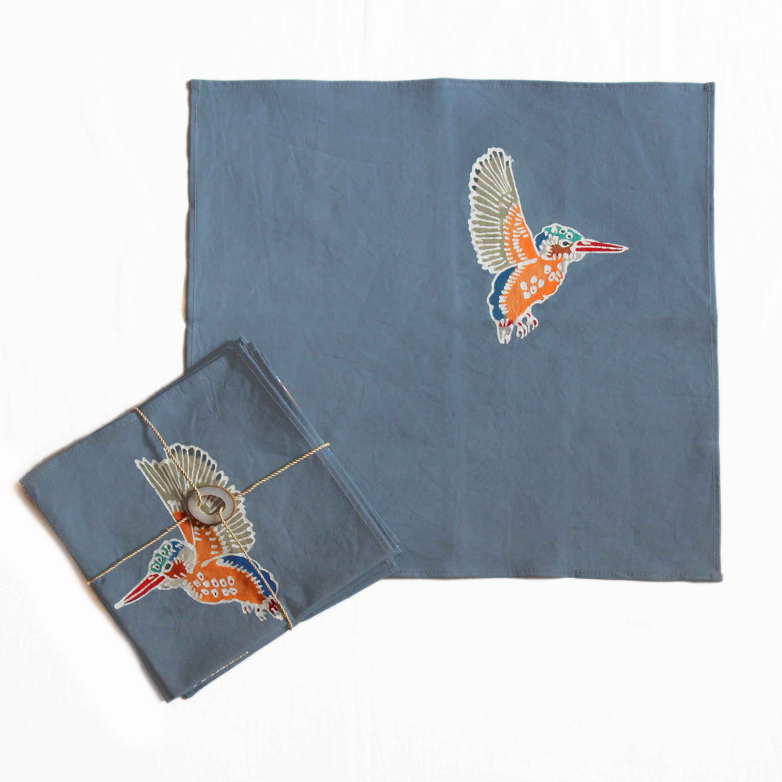 The perfect dark neutral napkins adorned with a colourful Kingfisher, the best way spruce up your sustainable dining table.