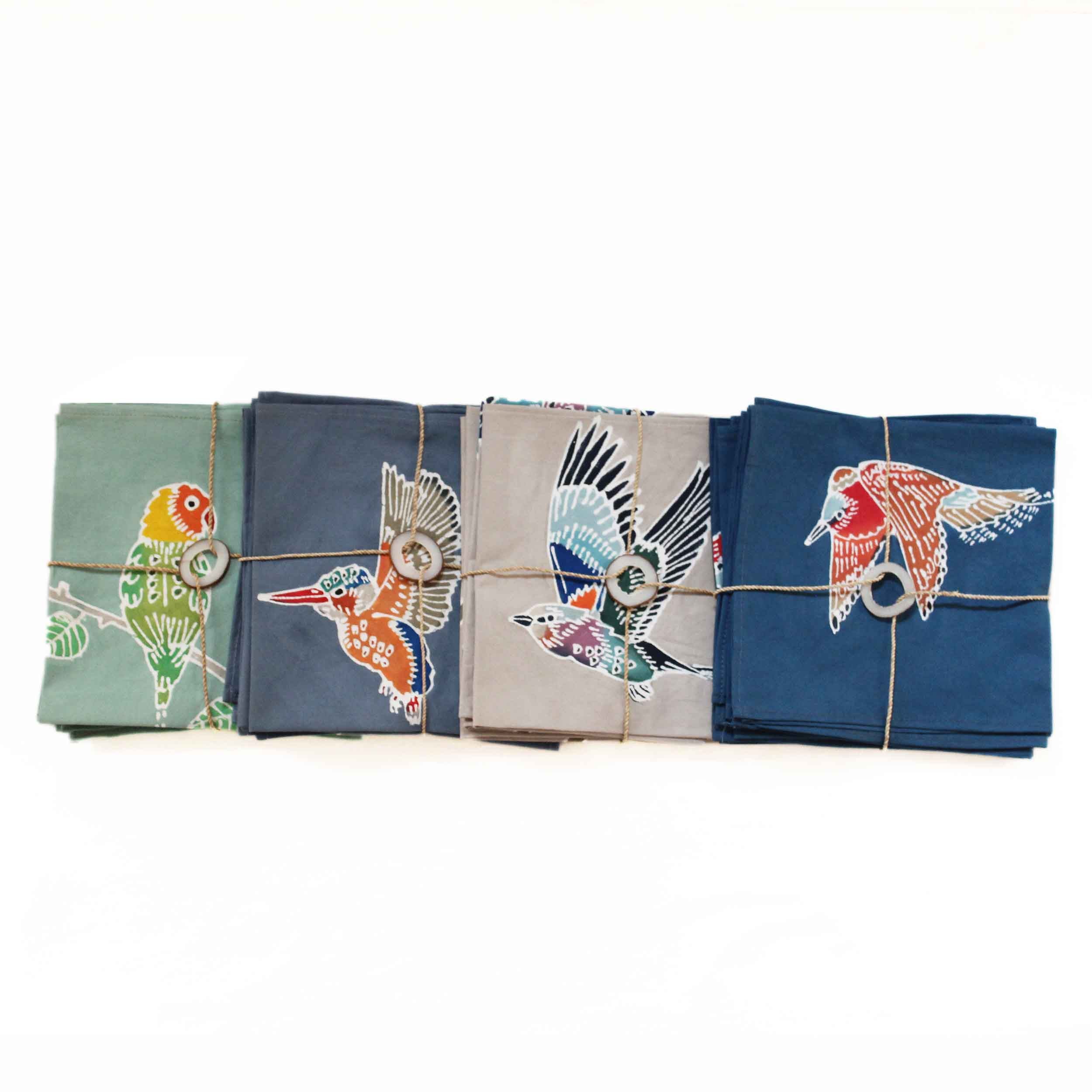 A perfect assortment of hand-mixed paints and handmade napkins each adorned with a colourful African Kingfisher.