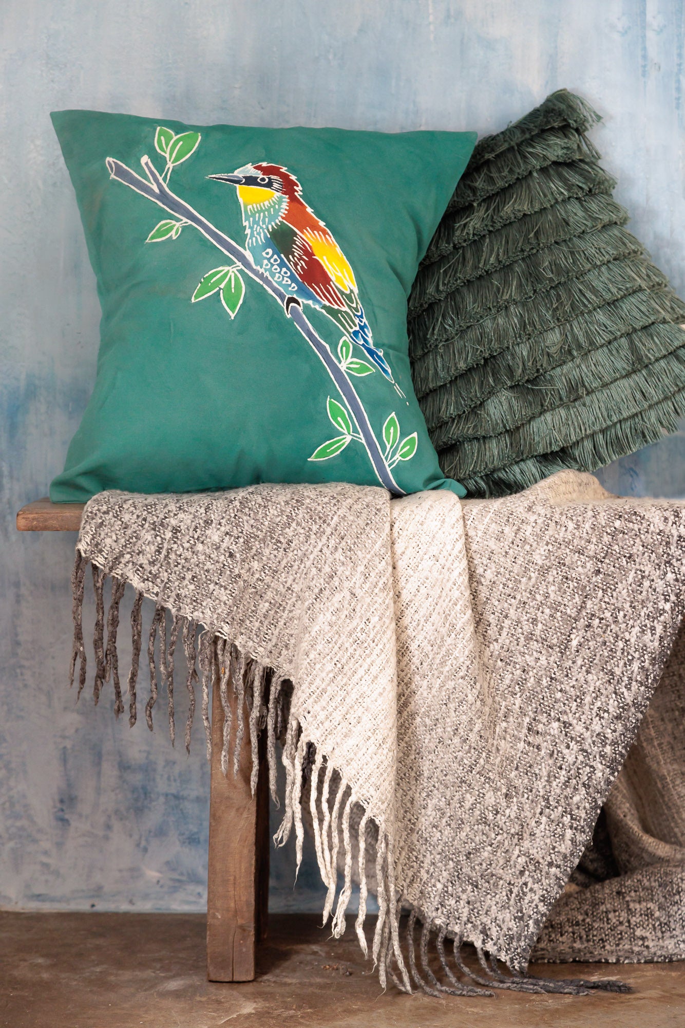 African made green cushion cover that will brighten any space with vibrant bird patterns and environmentally friendly fabric.
