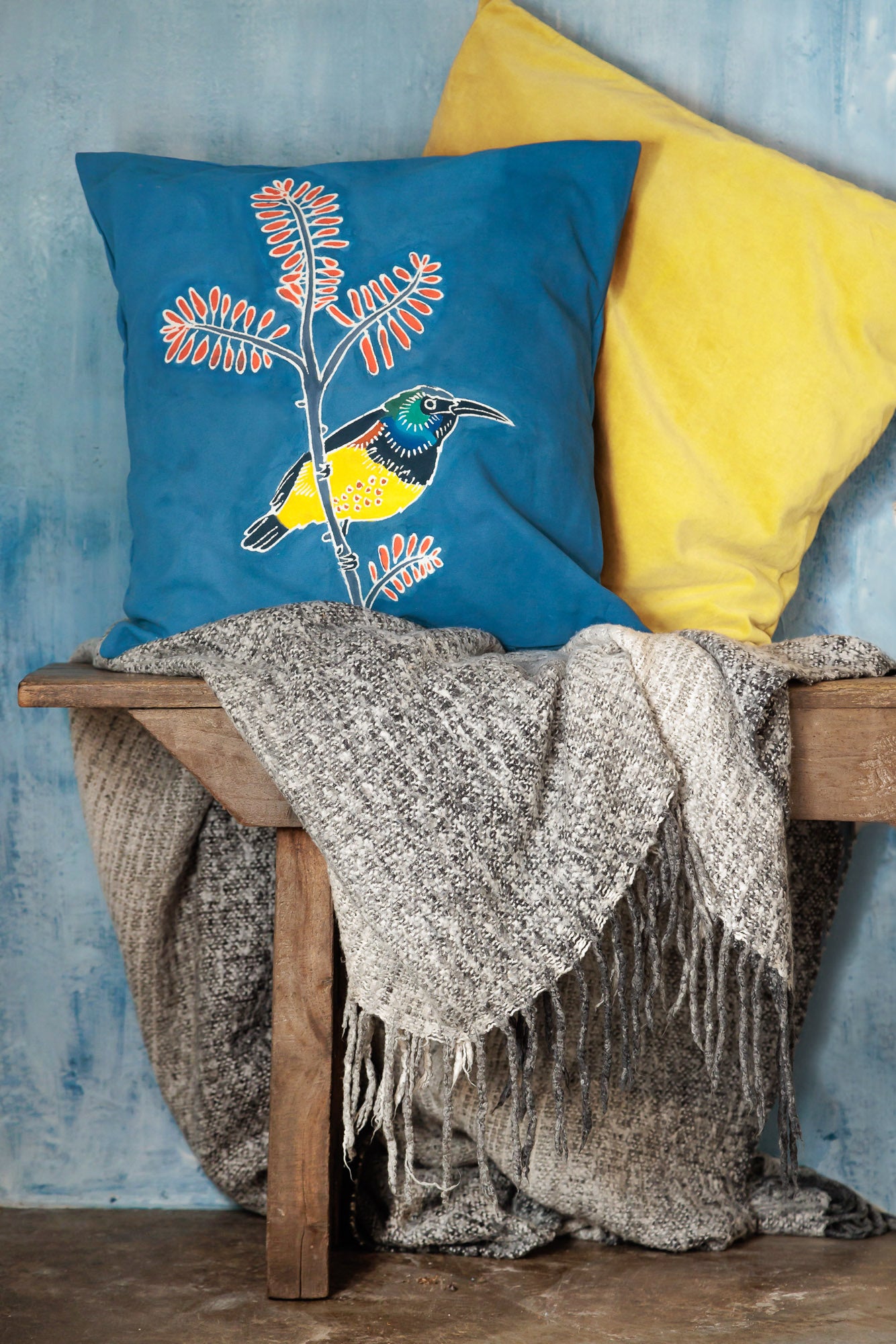 Add beautiful yellow sunbirds to your interior design choosing cushion covers that look good and do good.