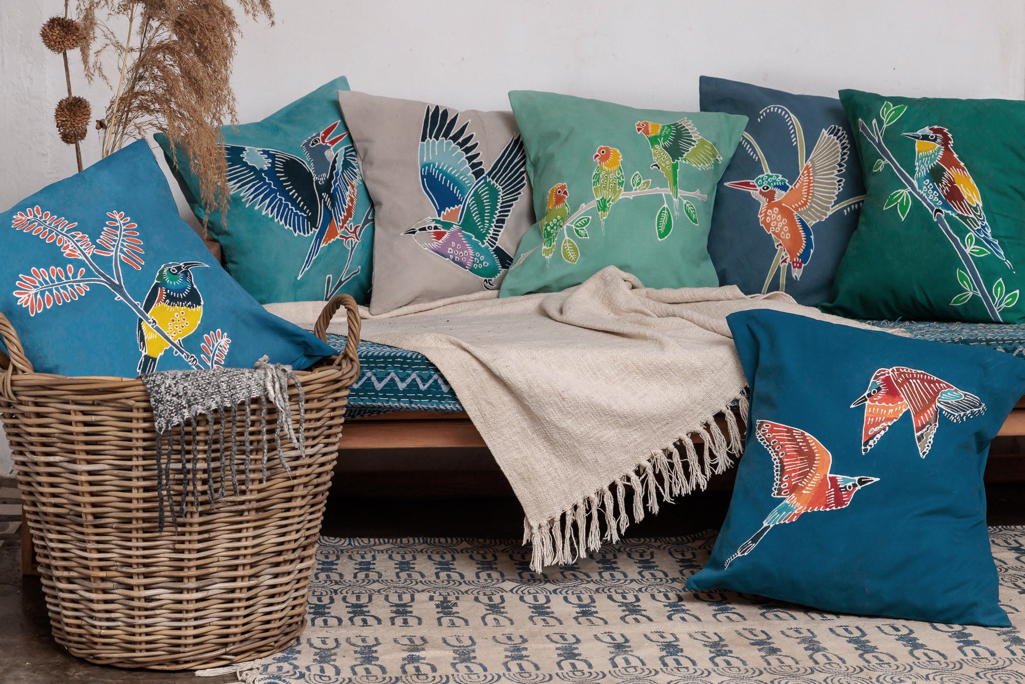 Night blue cushion cover with African wild bird adorned in a bright yellow.