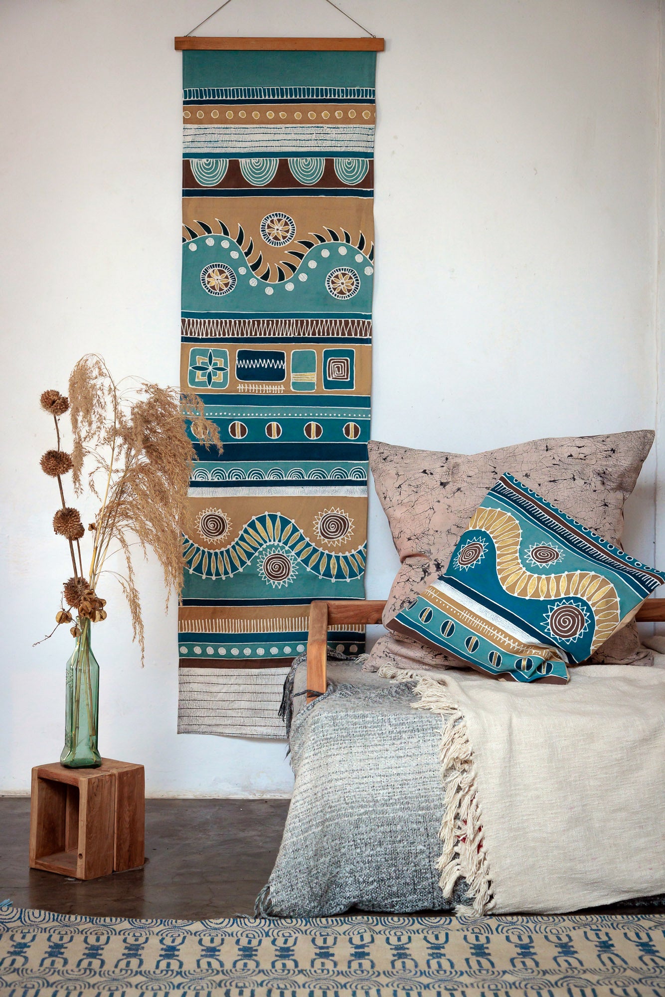 Deep blues and earthy colored wall hanging art, perfect for sustainable home interiors.
