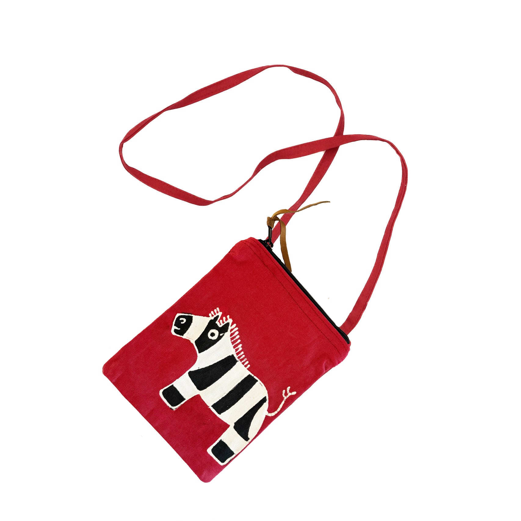 The perfect bright red zebra passport bag, for your kids to travel in sustainable style.