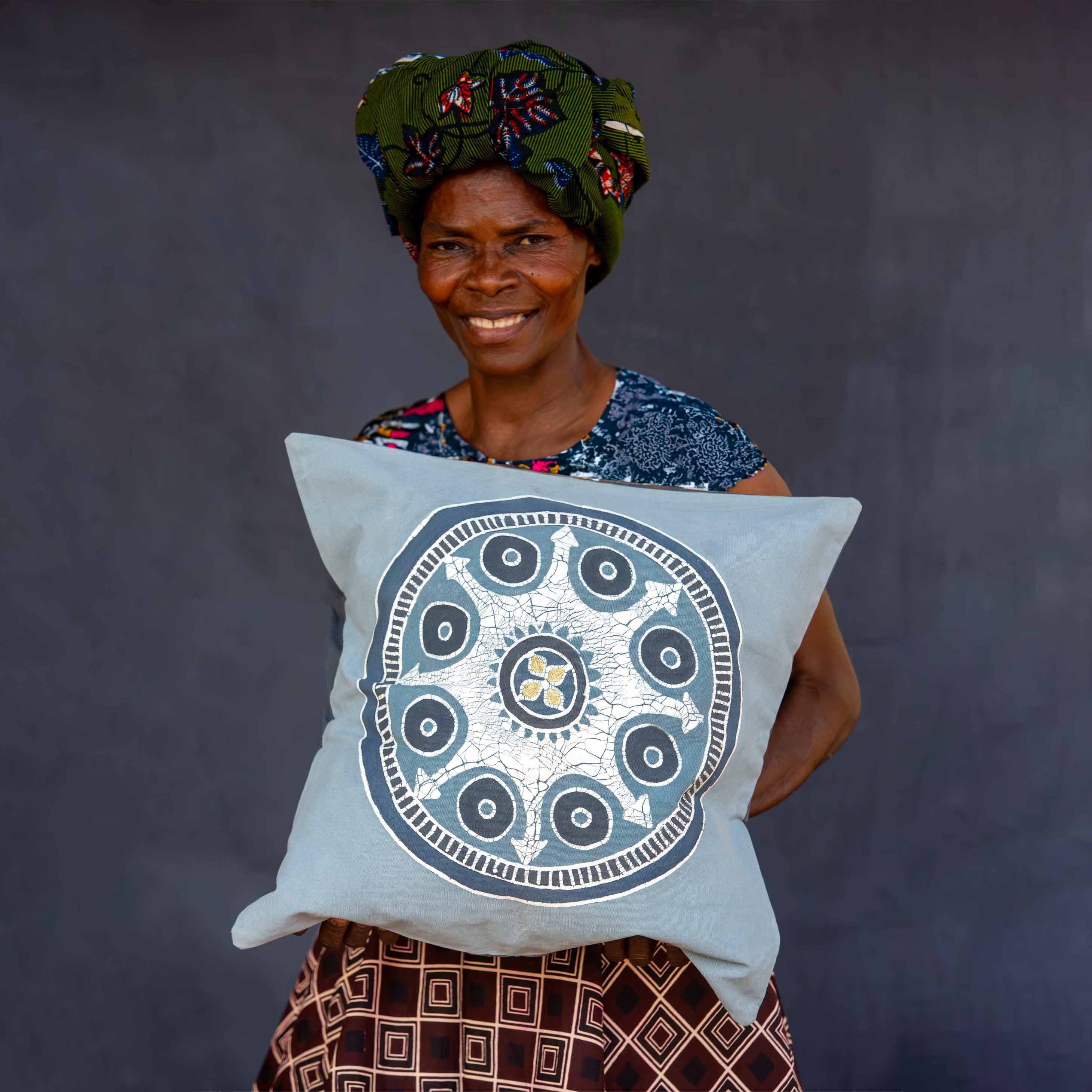 an artisan made cushion cover in blues