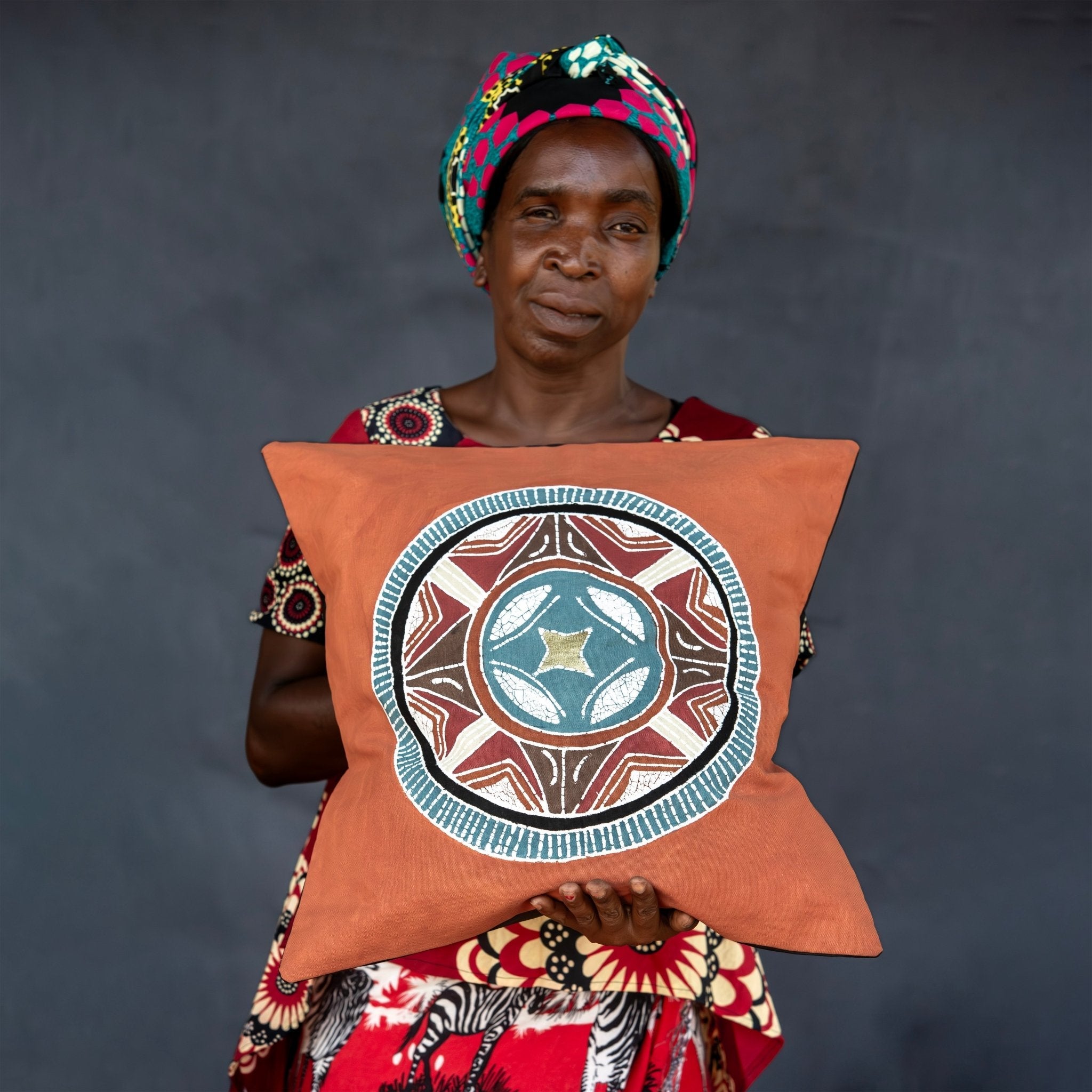 Looking to introduce Safari style into your home? Then look no further than our African Circles Massai Orange Cushion Cover.