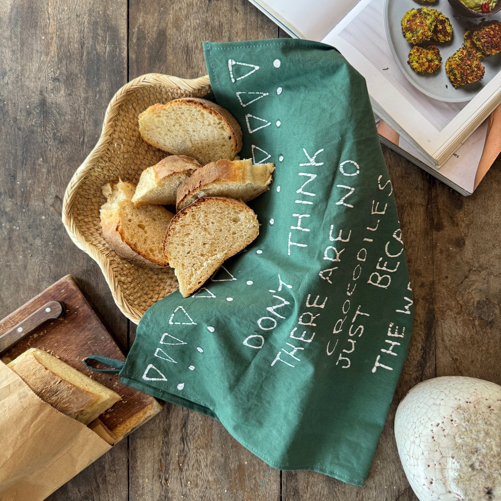 Green crocodile tea towel design, made in organic cotton in Zambia.