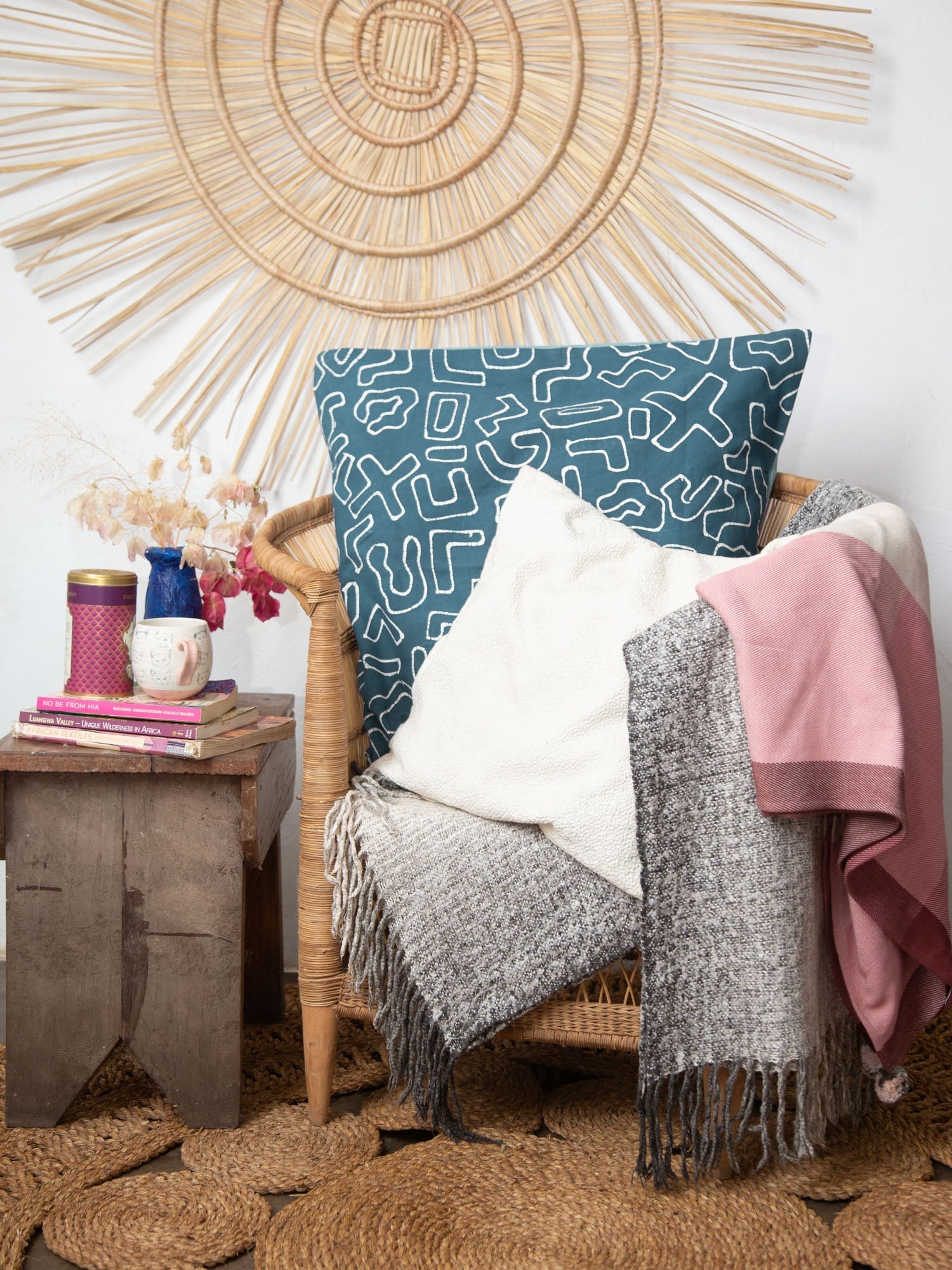 The perfect teal cushion cover, adorned with intricate African inspired patterns, made on 100% cotton.