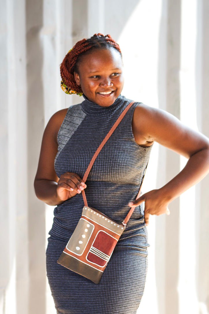 Passport bag in African batik patterns, handpainted in warm reds and oranges.