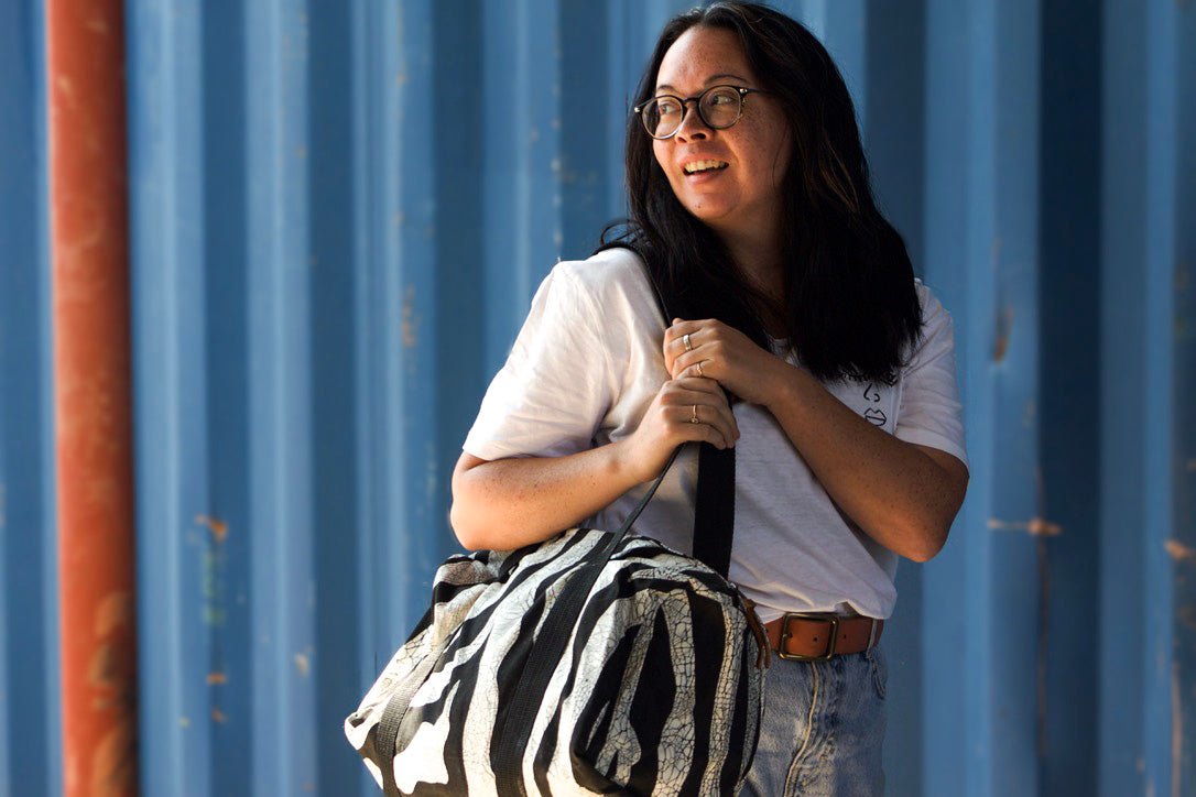 The perfect sustainable duffle bag, adorned in a zebra print and made from 100% cotton to look good and do good.