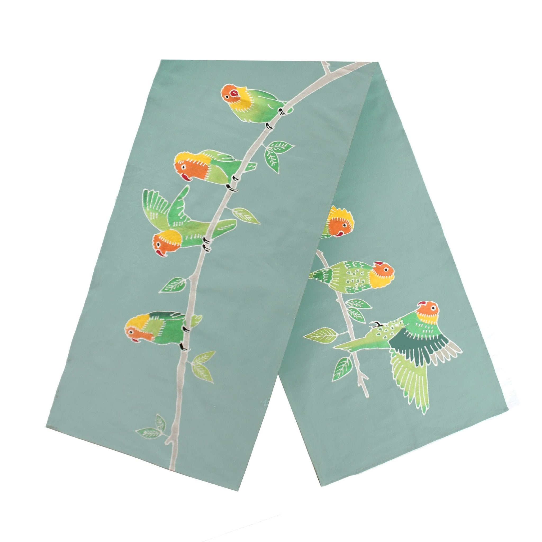 The perfect French green table runner adorned with hand-painted birds to add environmentally friendly elegance to your table.