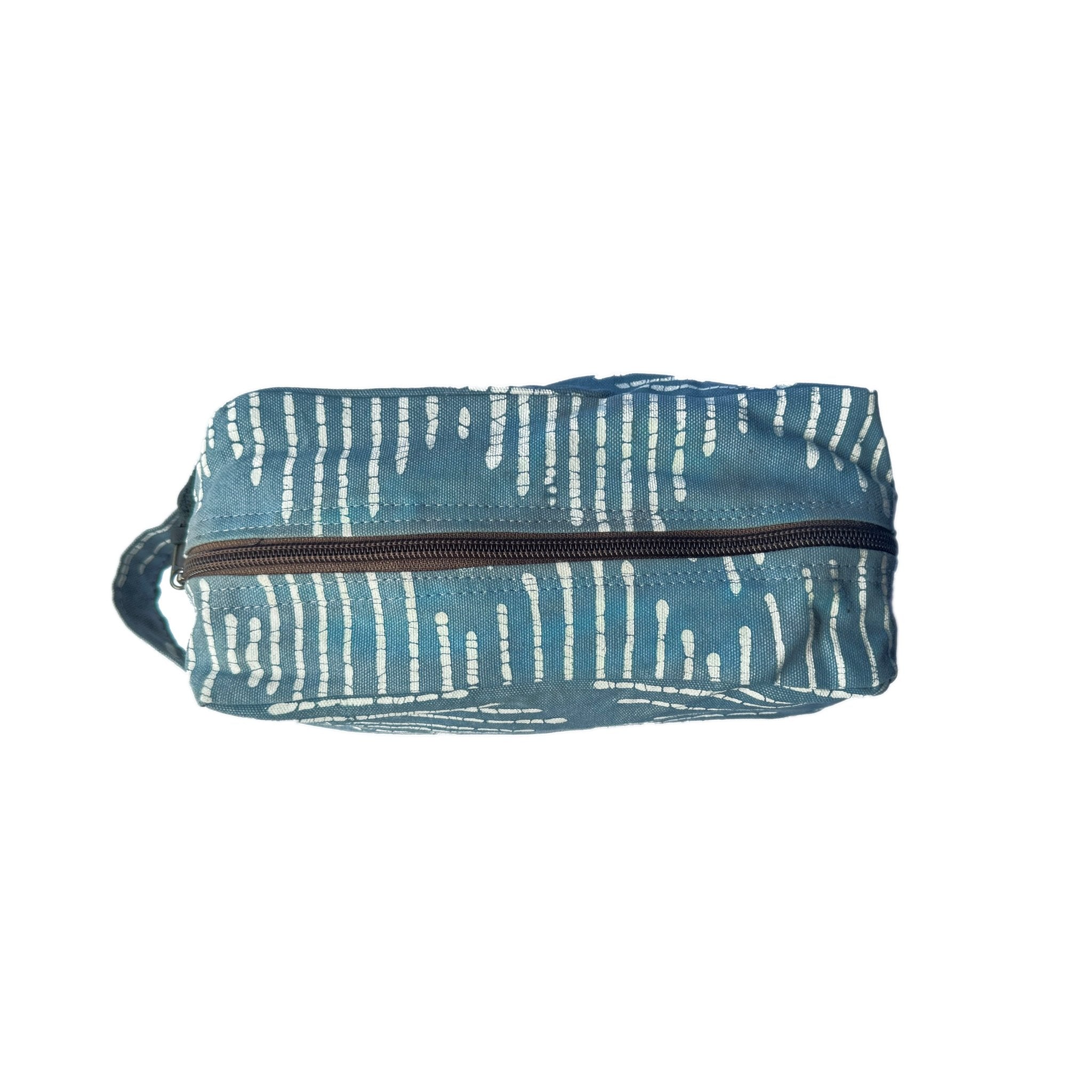 Travel in sustainable style with our indigo travel pouch adorned with a funky wave pattern to wow.