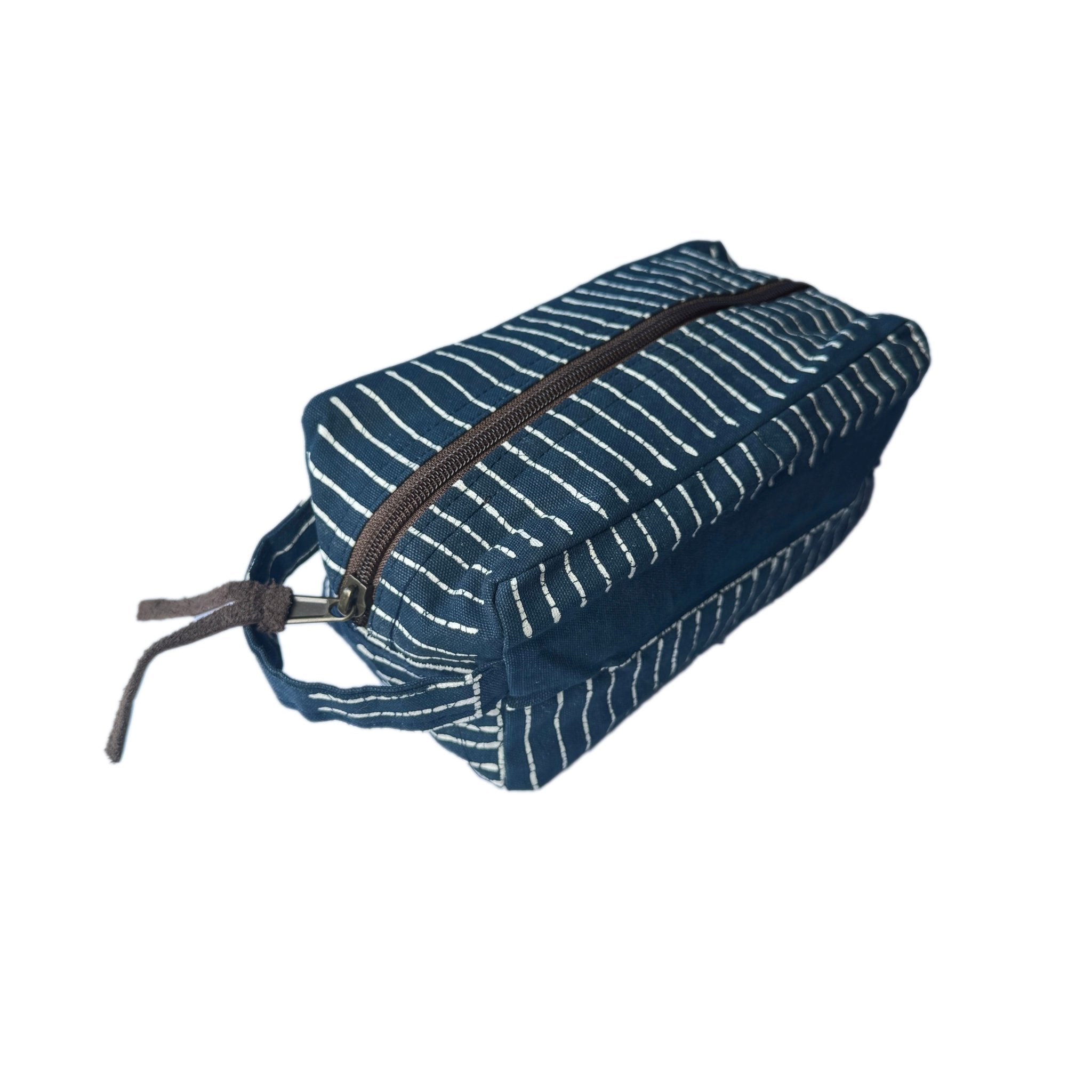 The perfect bohemian chic travel pouch adorned with a linear Batik pattern, made ethically in Africa.