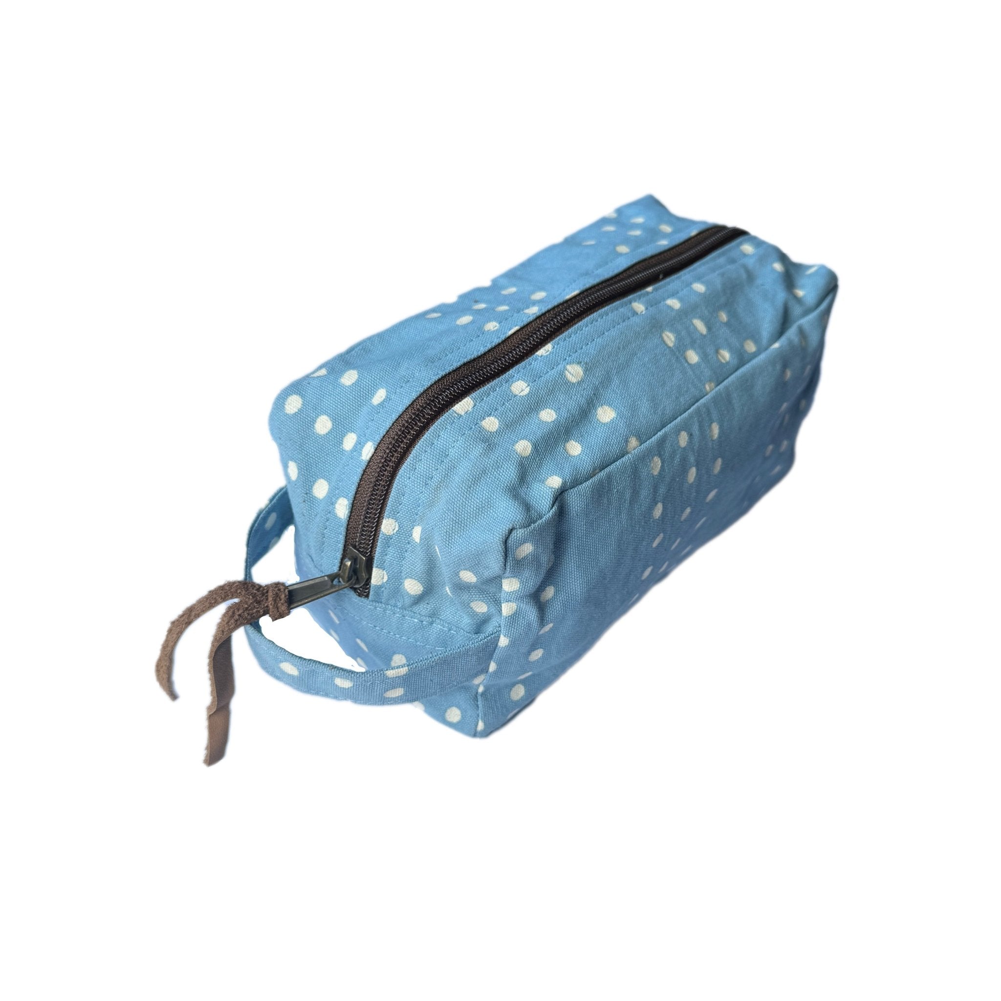 Beautiful light blue travel pouch adorned with delicate dots and made from 100% cotton.
