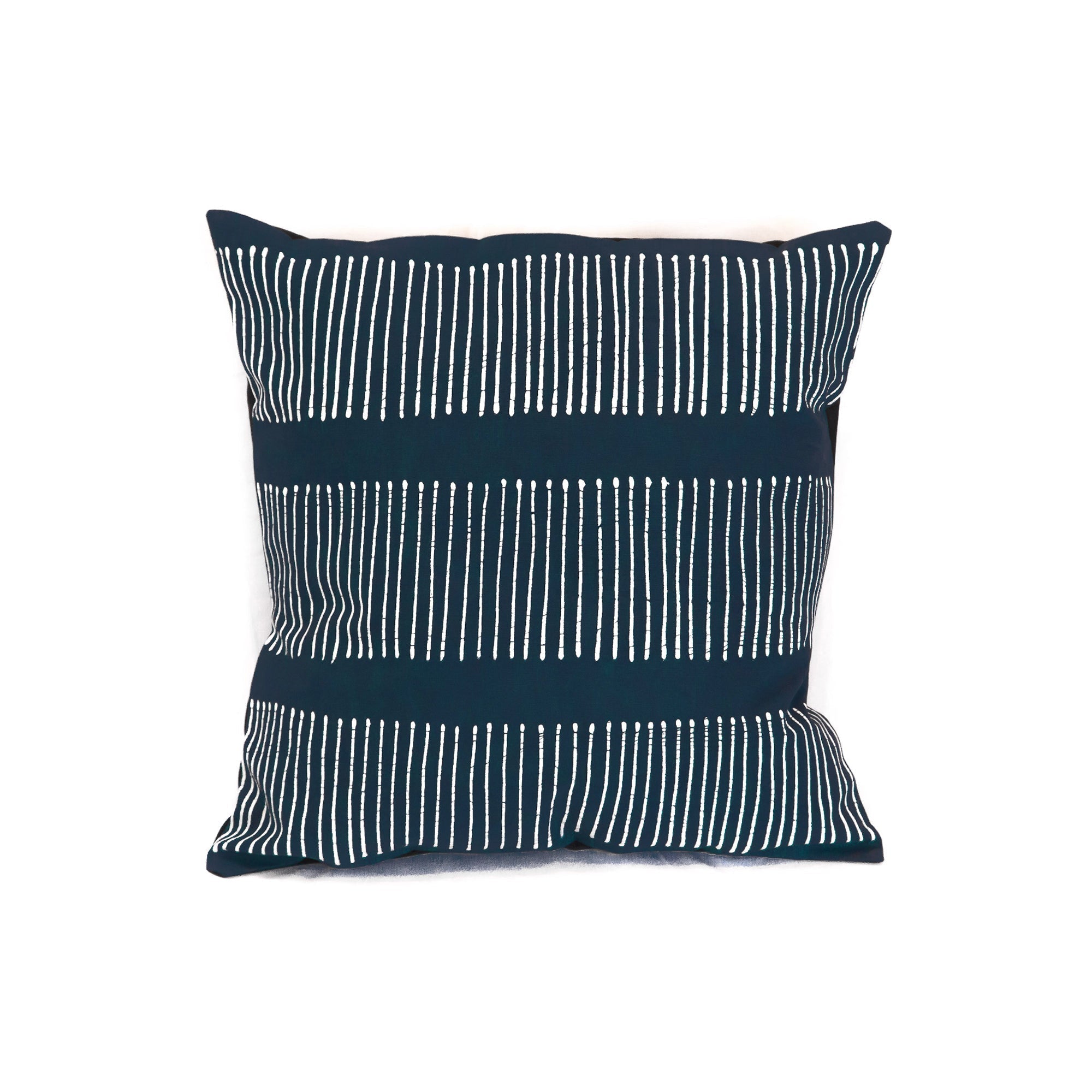 Deep indigo cushion cover with intricate rake pattern, made sustainably with ethical certifications.