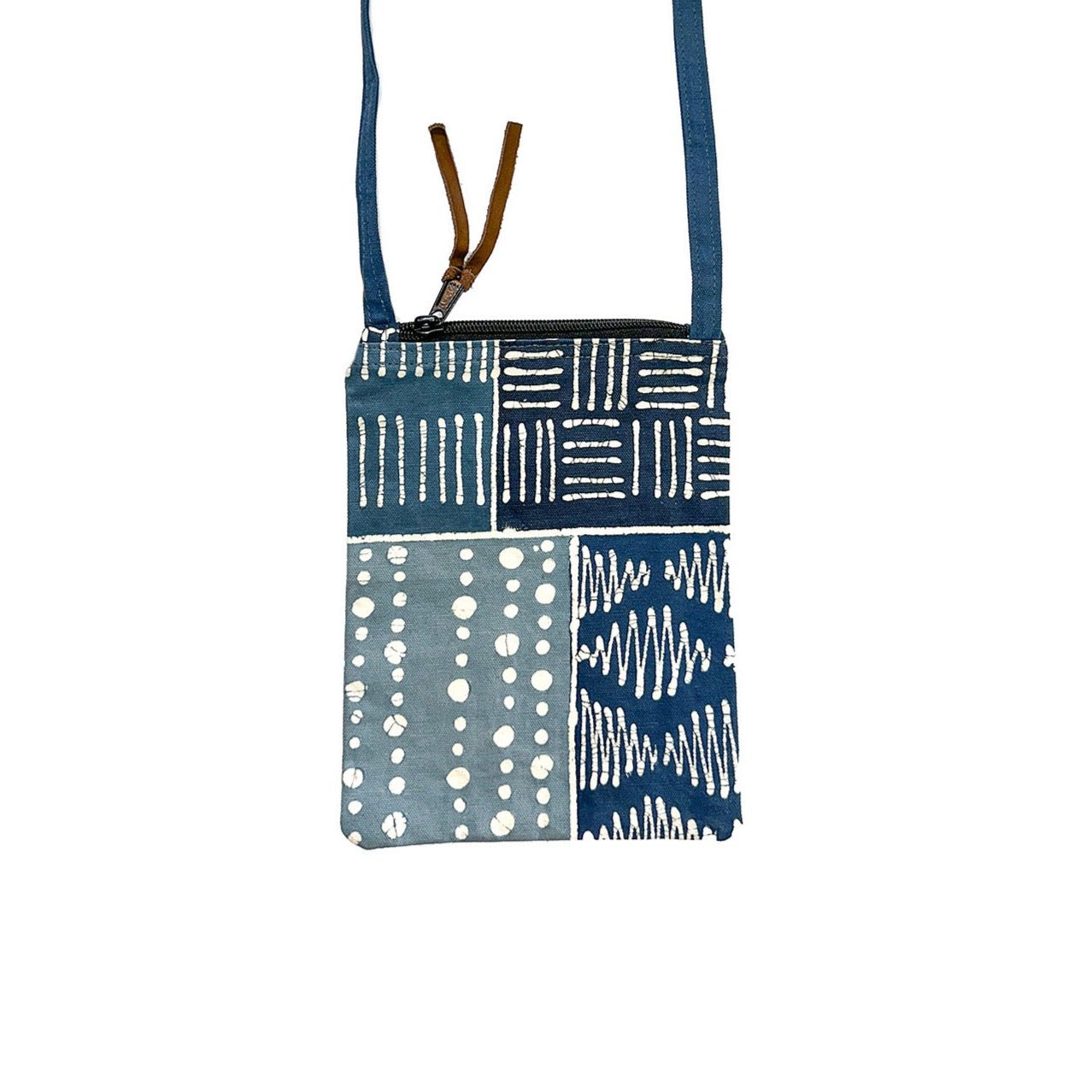 Cross body small passport bag with African tribal print inspired by mudcloth in a patchwork of blues.