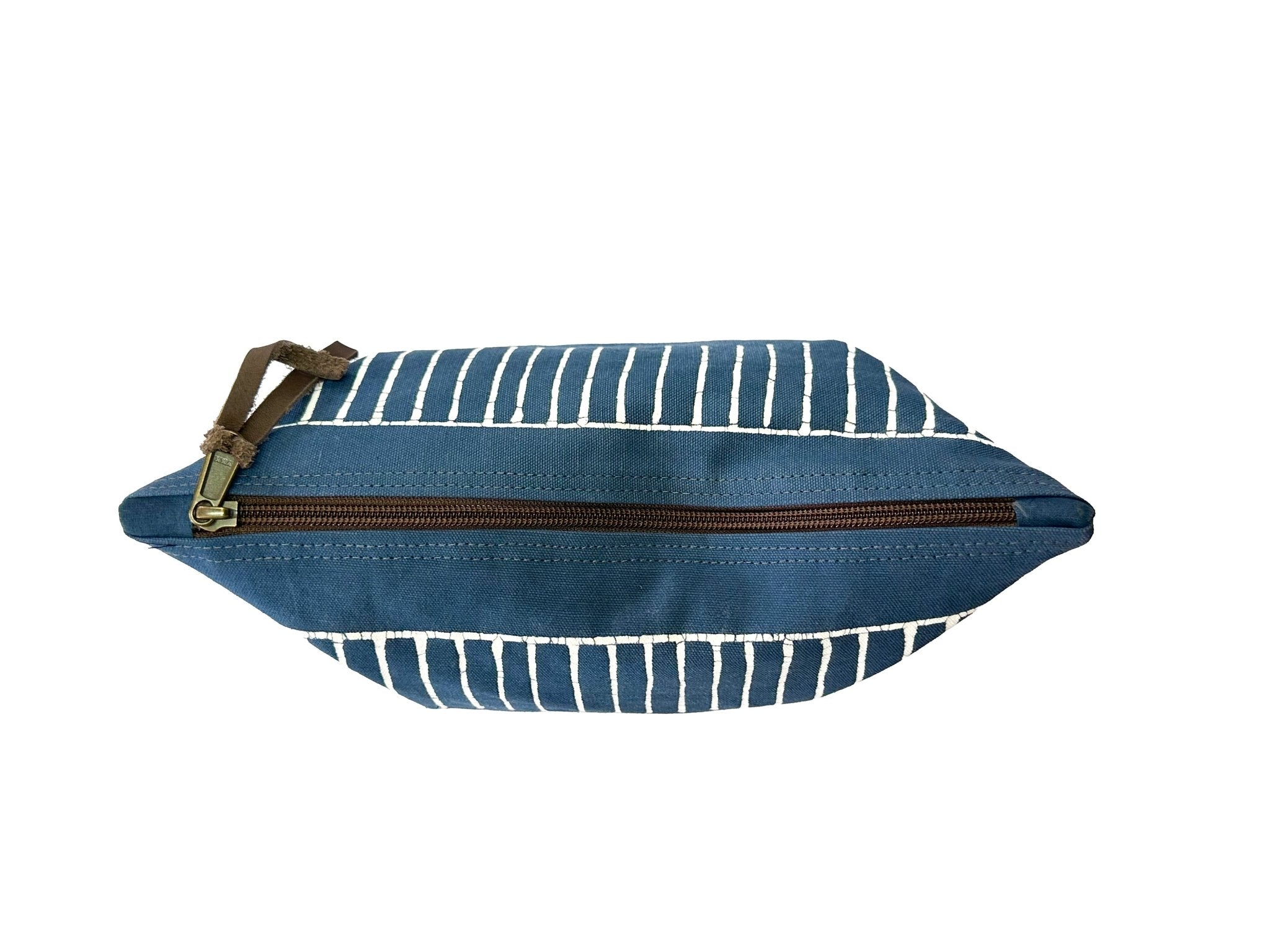 Zip up dark indigo wash bag with mudcloth tribal pattern made from cotton.