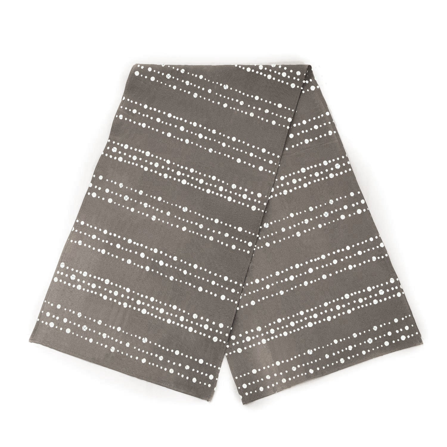 The perfect African-made table runner, in a charcoal with intricate dotted patterns. Made for eco-conscious households.