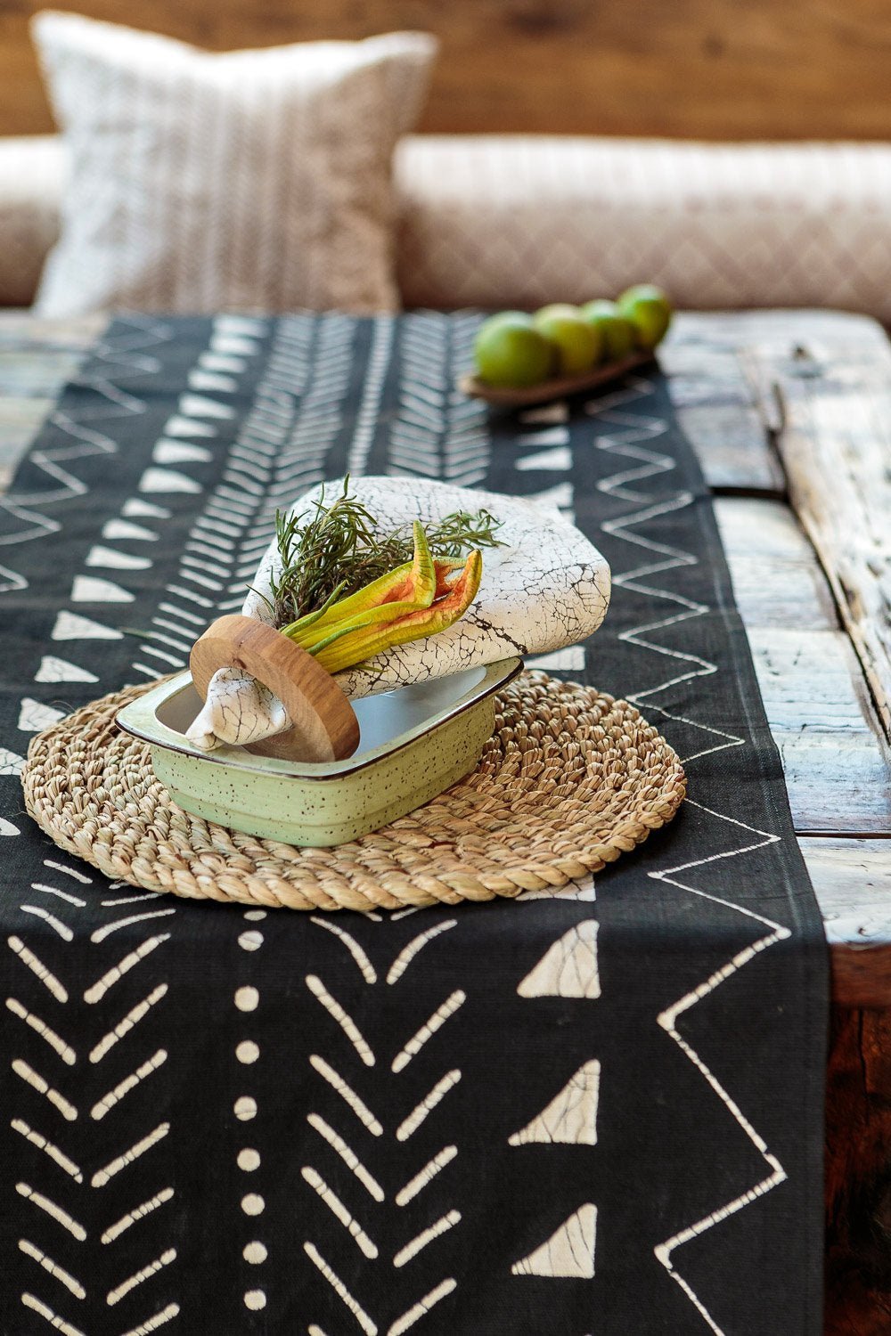 Eco-friendly table runner in black mudcloth inspired pattern, perfect for sustainable dining.