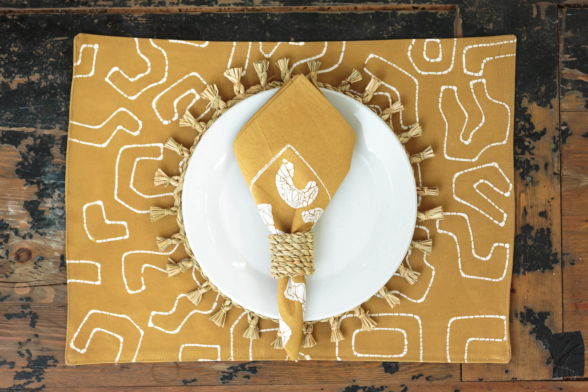 Vibrant mustard with graphic batik line patterns inspired by african made with 100% cotton fabric in a set of 6