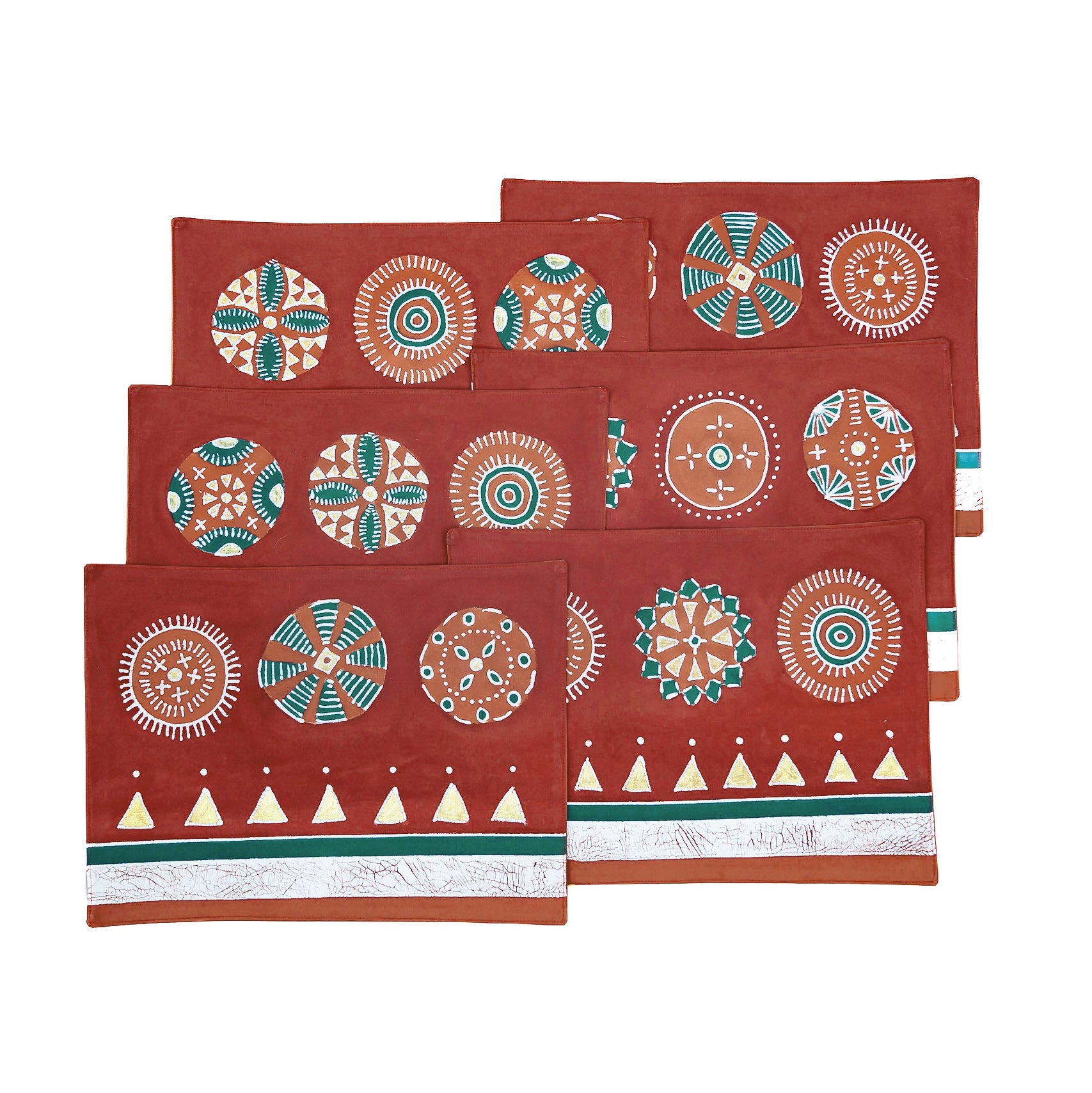 Deep red table mats adorned with gold accents and detailed circles.