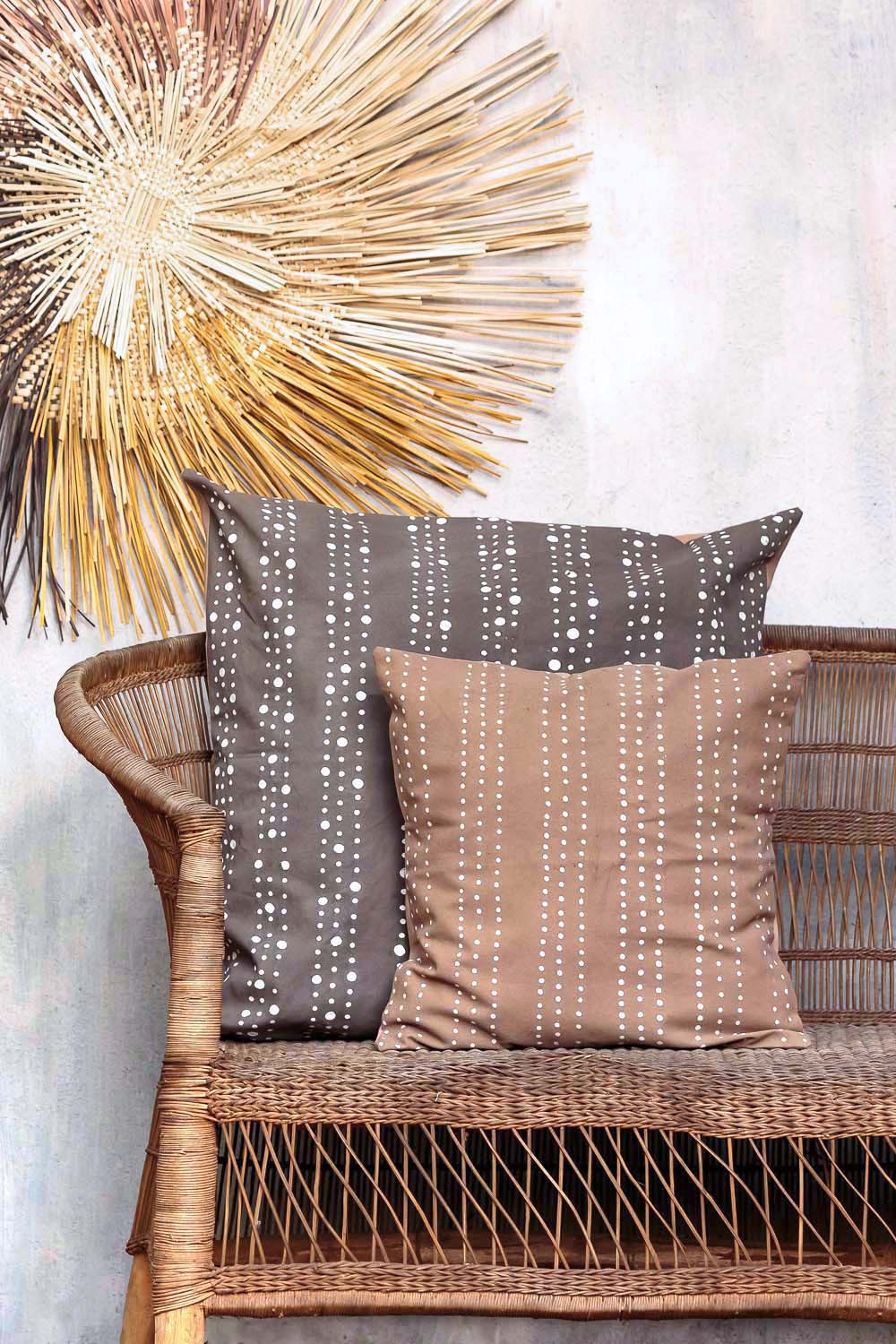 Stylish and sustainable cushion cover adorned with beaded dots and made ethically.