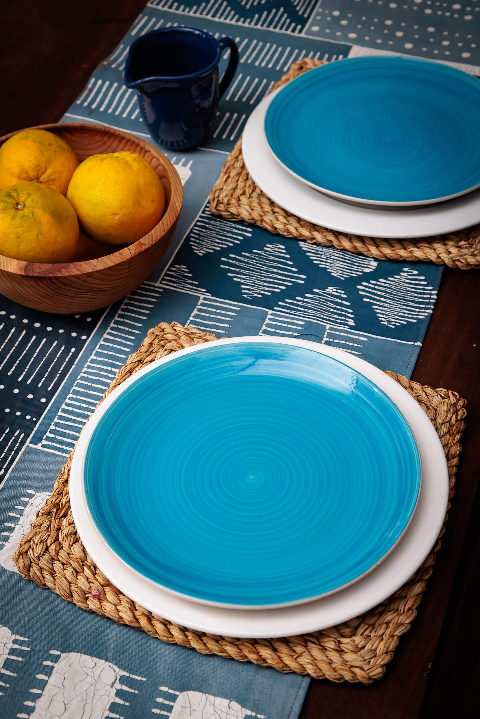 Sustainable table runner made from blue patchwork in Africa with intricate patterns.
