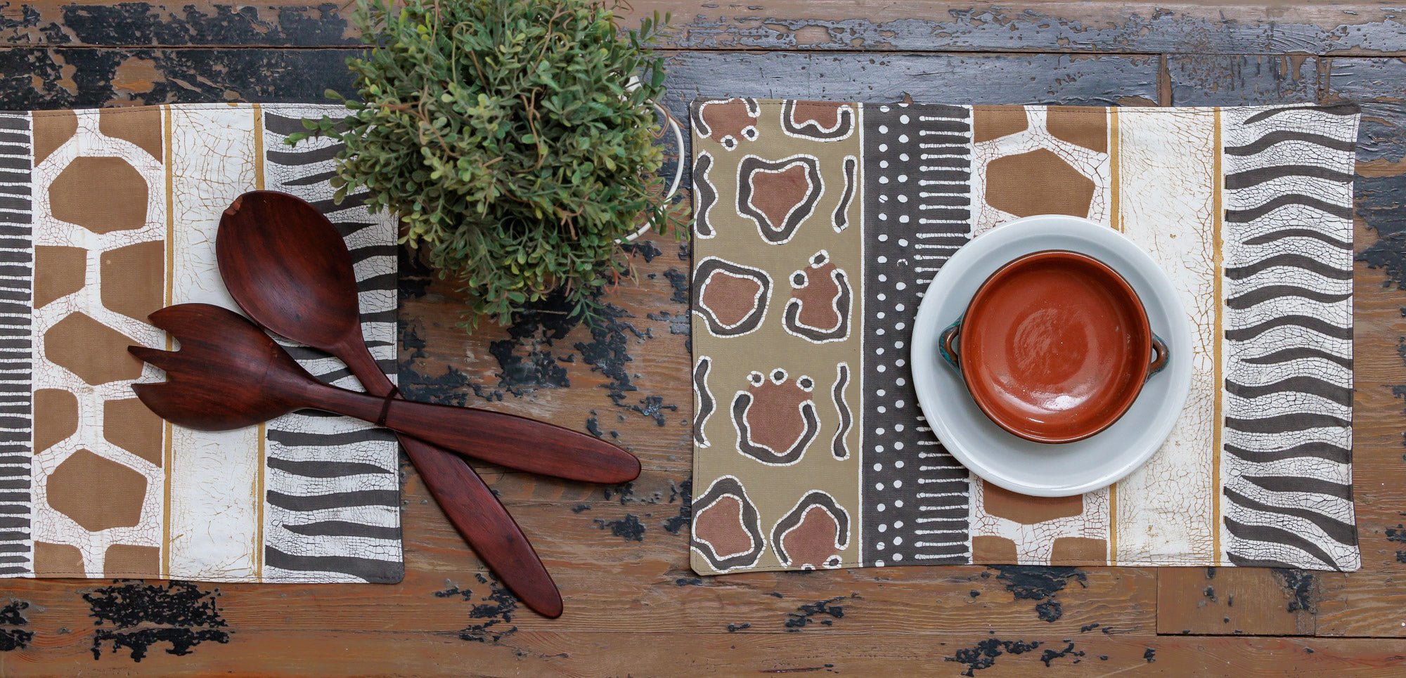 African made and hand painted table mats, with intricate animal print designs.