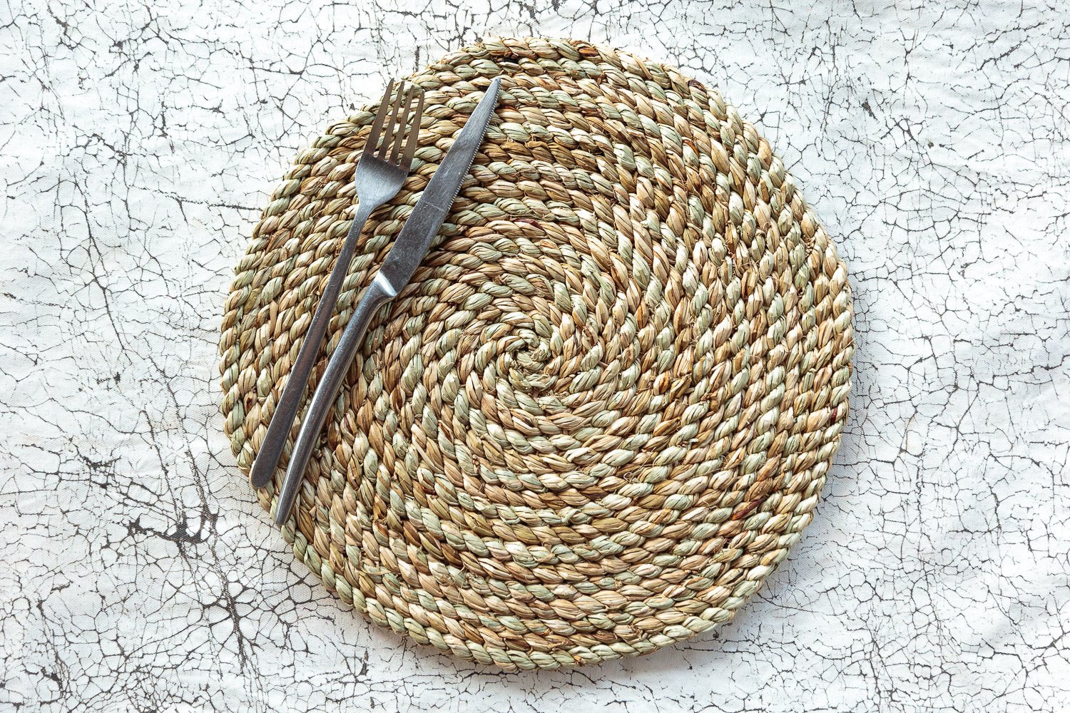 100% sustainably sourced placemats, complete with hand woven coil designs.
