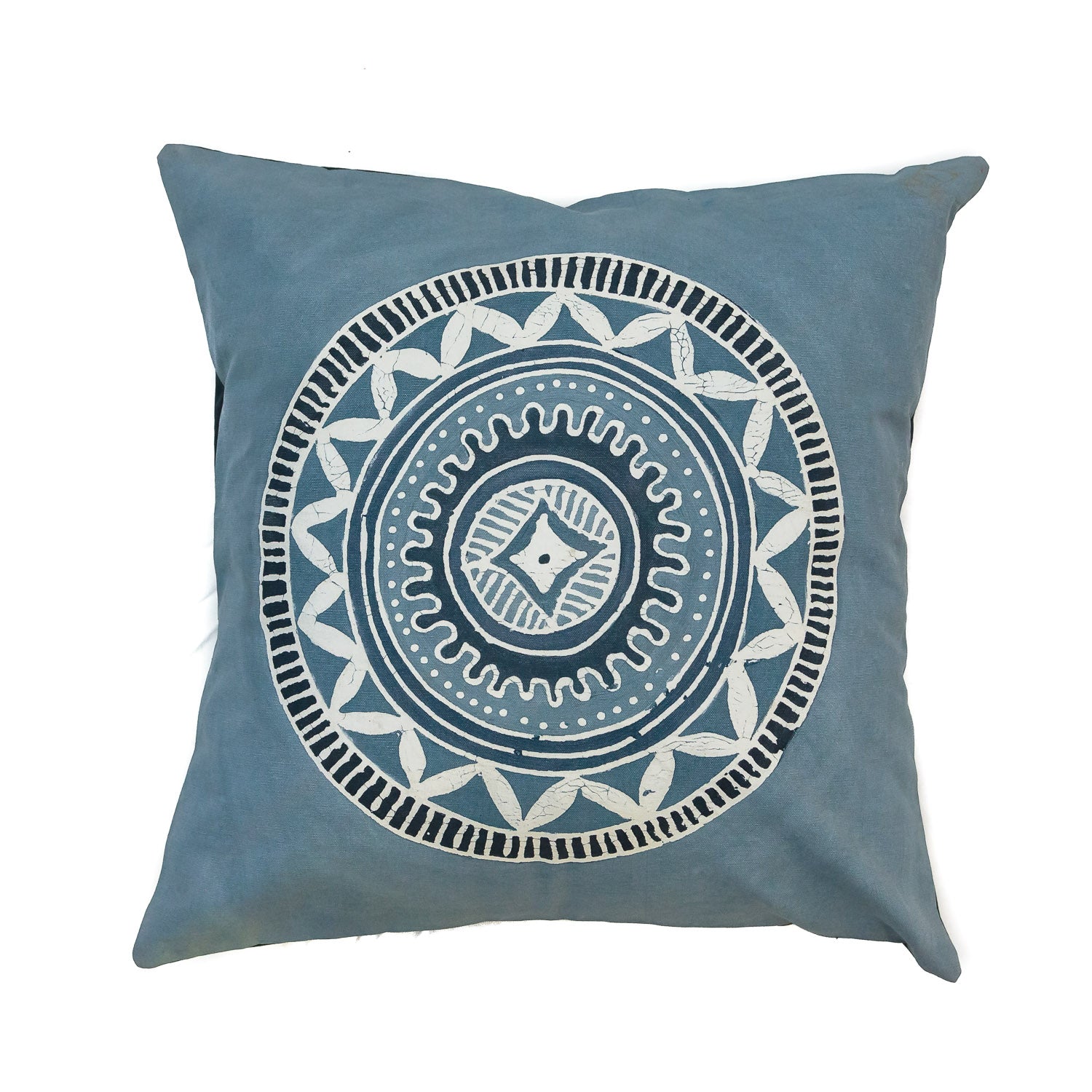 A blue cushion cover, with african tribal patterns, handcrafted in a batik technique and hand-painted on organic cotton