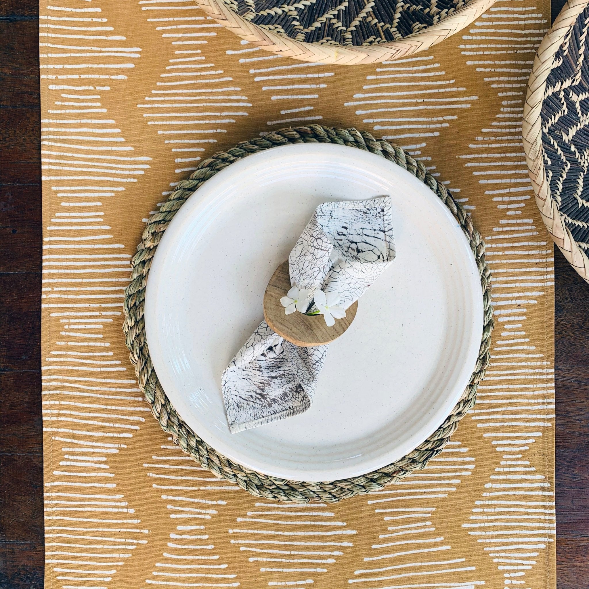 Bright and bold yellow table runner perfect for sustainable homes, adorned with interesting wave pattern.