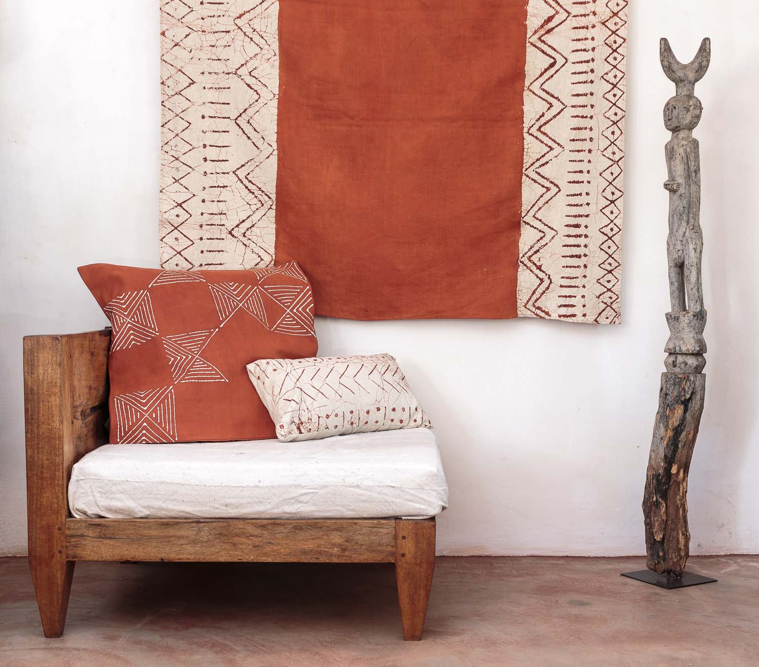 Eco-friendly pillow cover in Matika red Rust Grid, blending African-inspired motifs with modern decor.