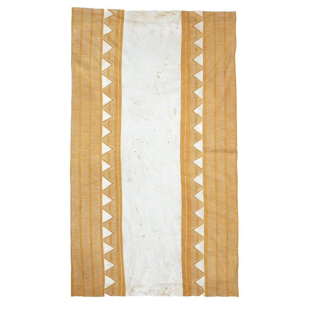 Handcrafted Matika Mustard Linear tablecloth, bringing modern flair to your dining setting.