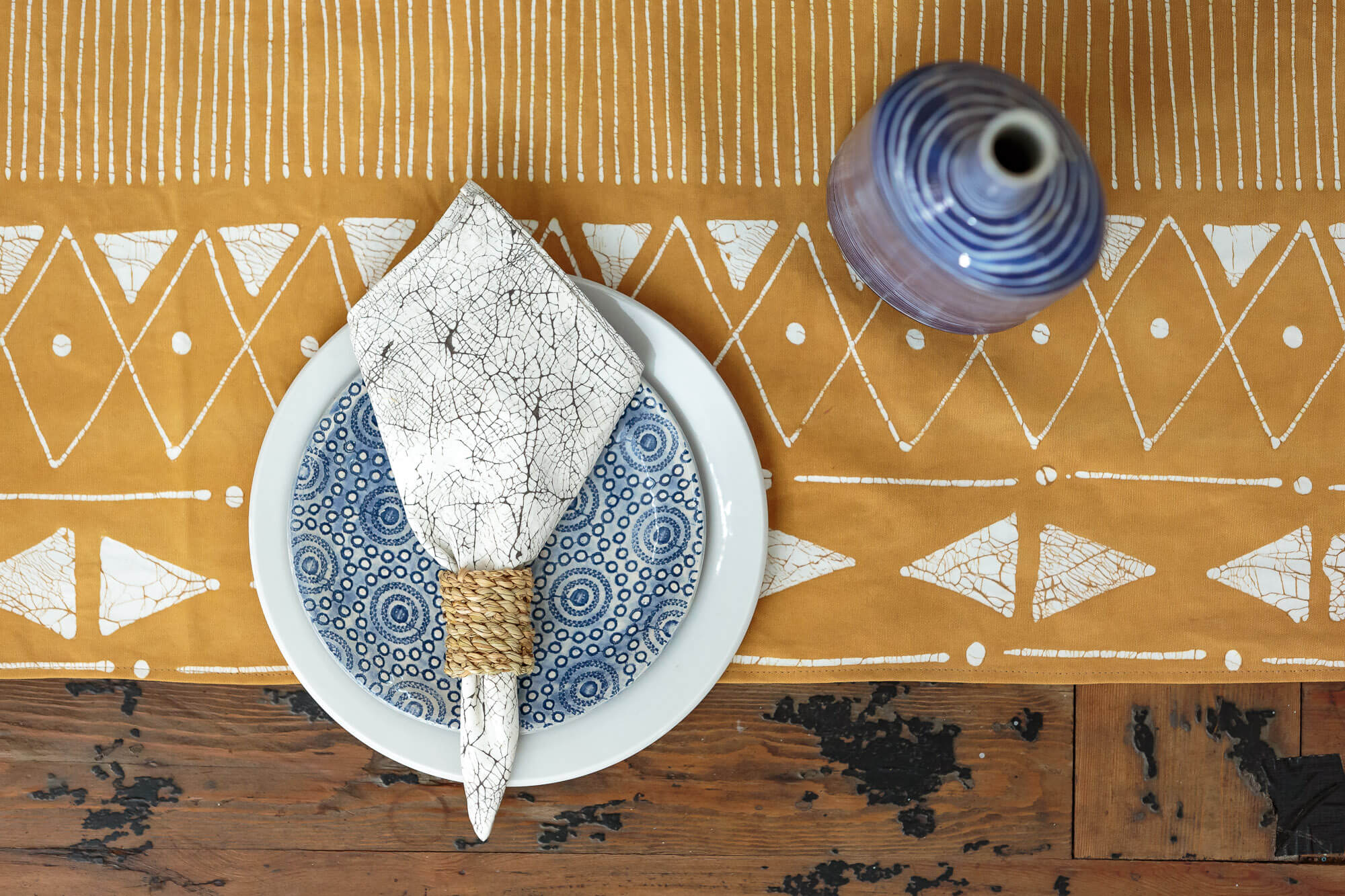 Eco-friendly table runner in Matika Mustard linear design, ideal for sustainable dining decor.