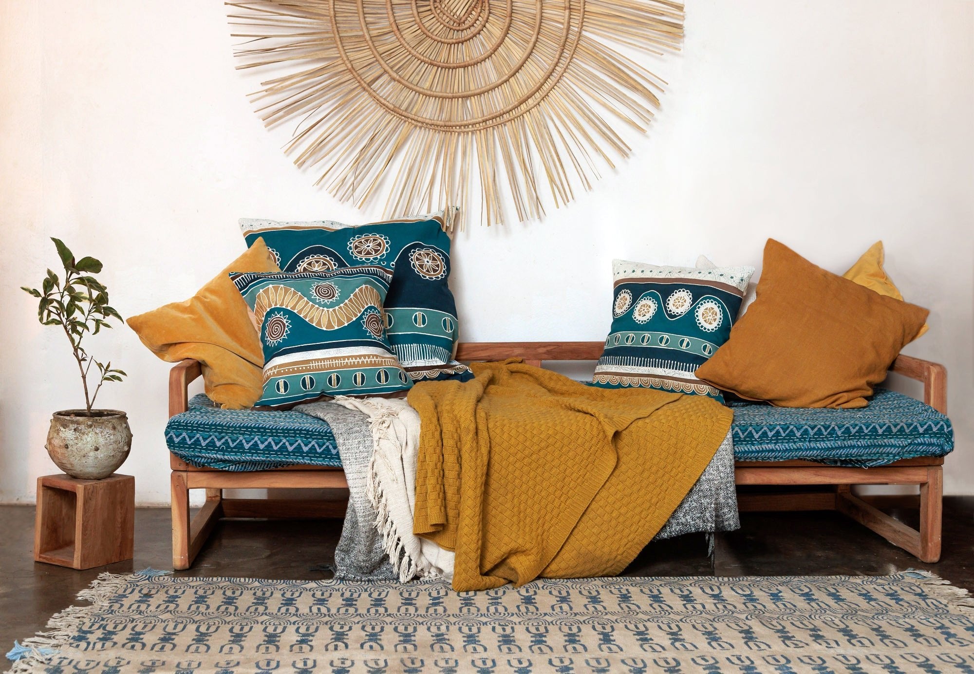 African-inspired pillow cover, blue and earthy tones, perfect for home decor.