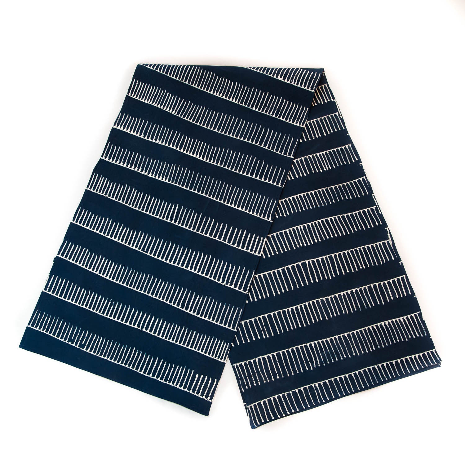 Beautiful indigo table runner with delicate line pattern made from 100% cotton.