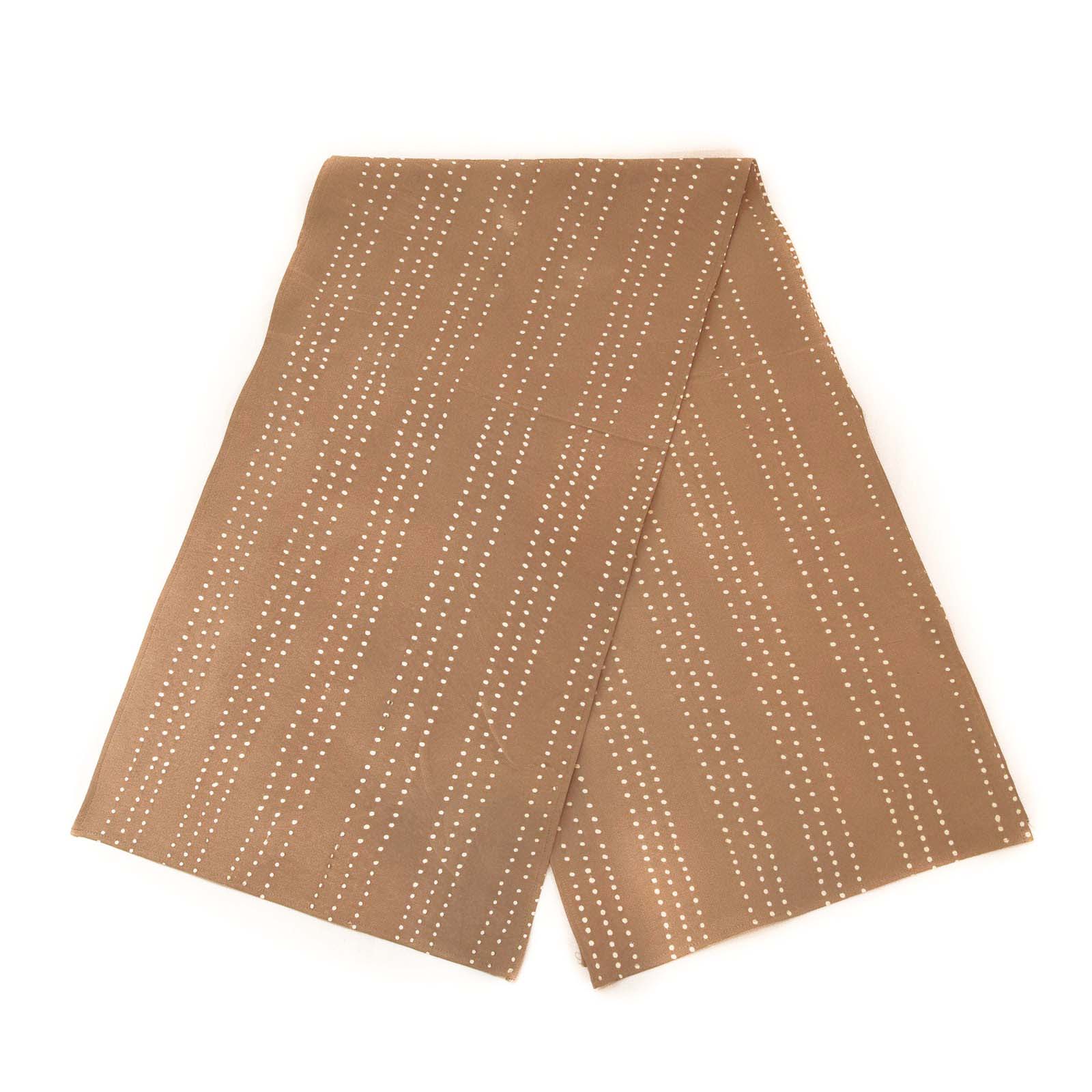 Beautiful mustard yellow table runner adorned with delicate dot patterns made stylish and sustainable.