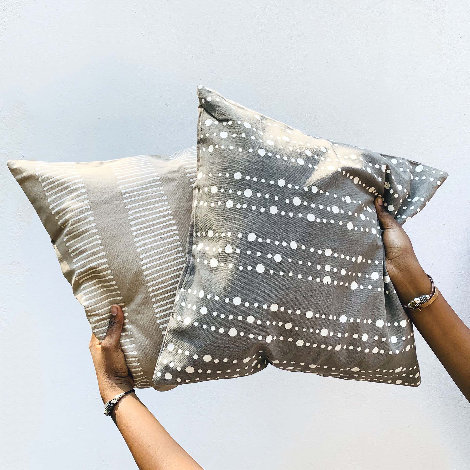 Hand painted grey cushion cover with delicate dots, made from 100% cotton making it the essential sustainable neutral.