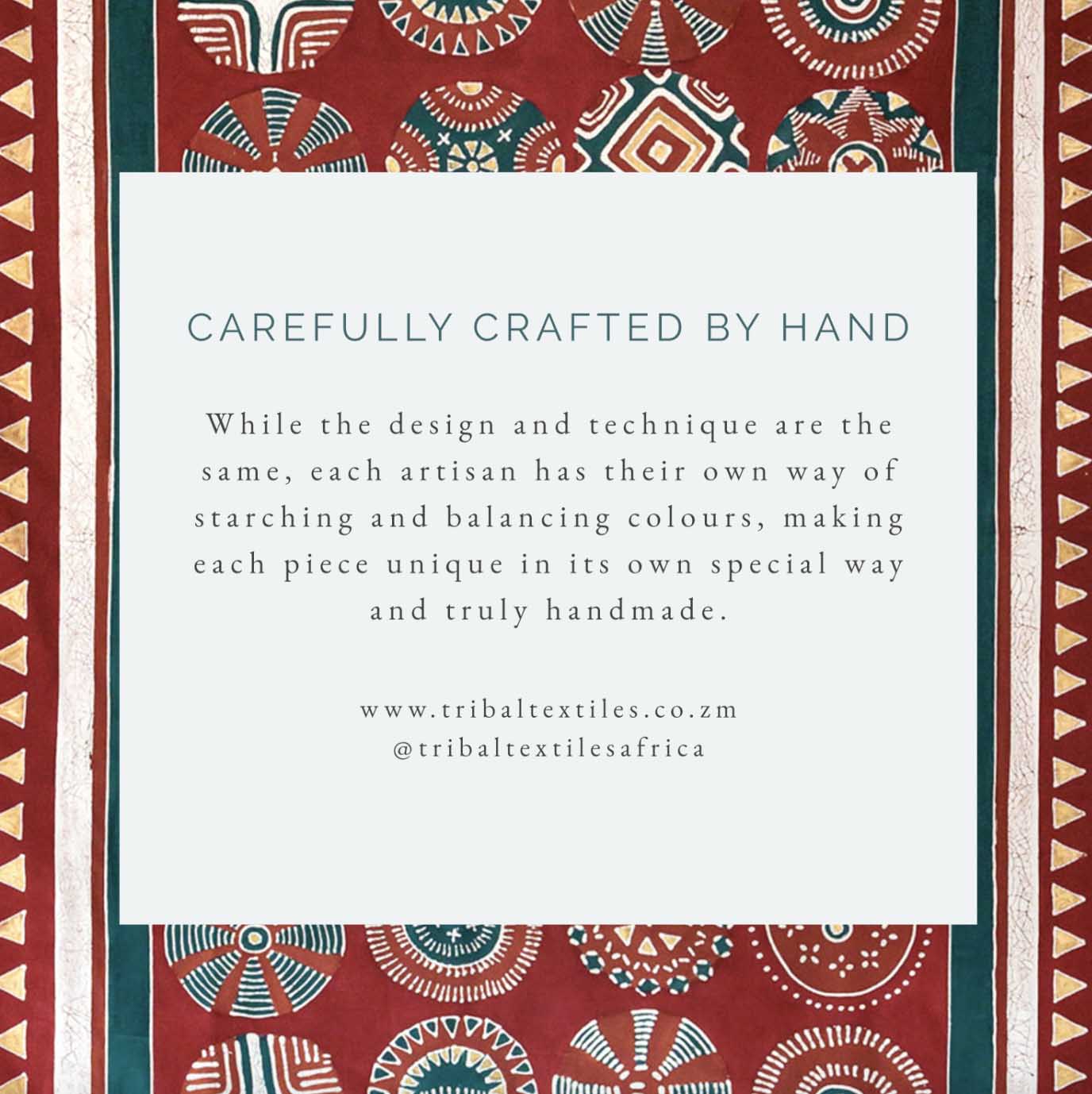 African made red tea towel, adorned with gold accents and intricate patterns inspired by Kuosi elephant tusks.