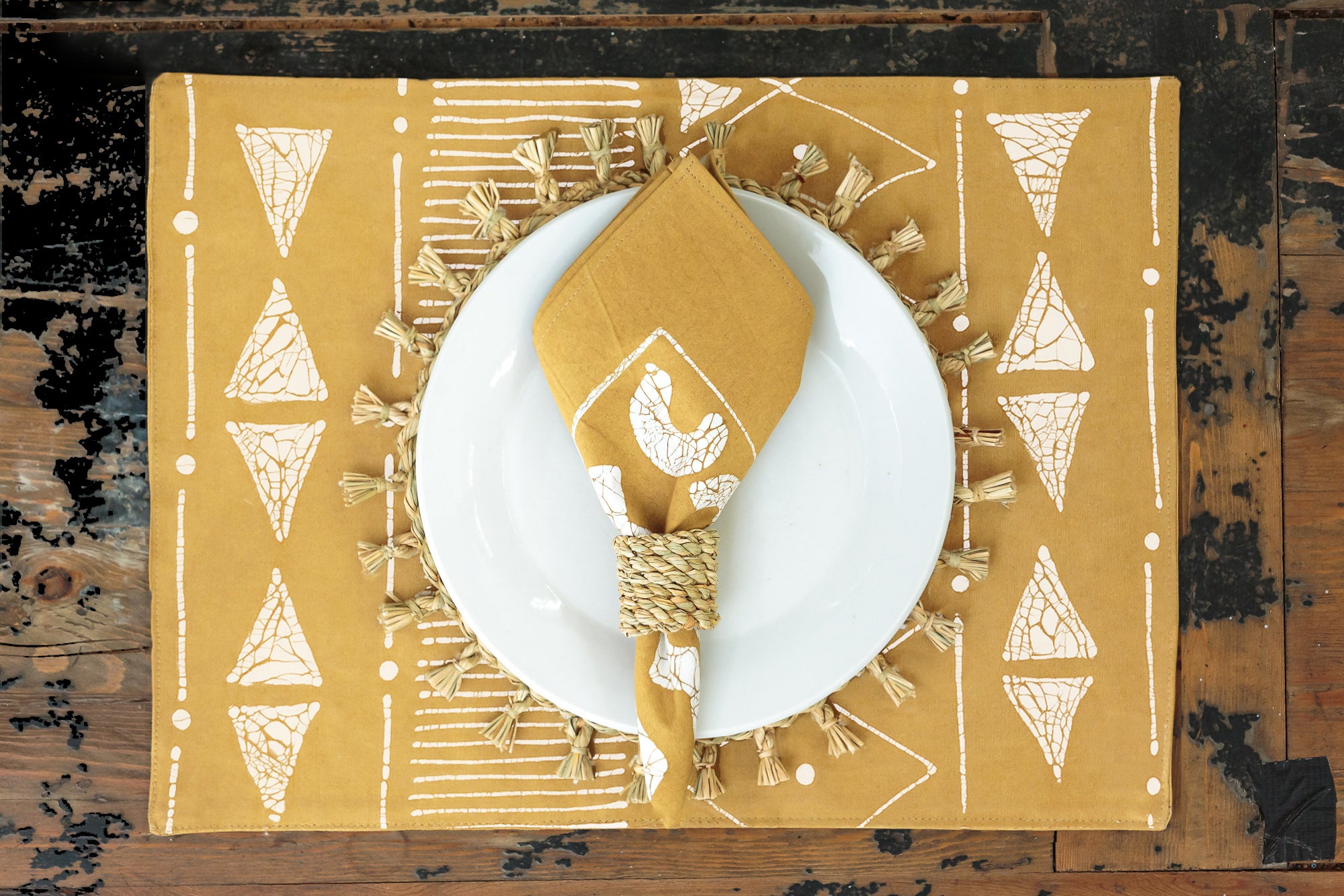 Eco-friendly table mats in Matika Mustard linear design, ideal for sustainable table settings.