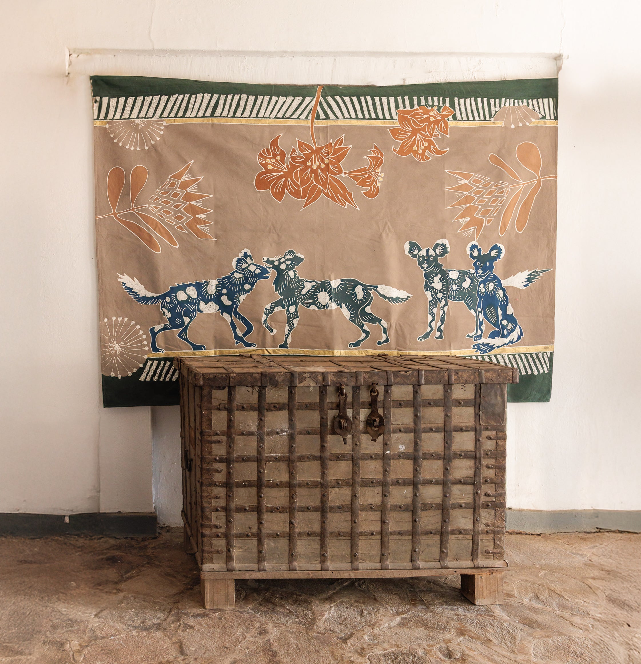 Artwork wall hanging cloth featuring painted wild dogs, in support of conservation