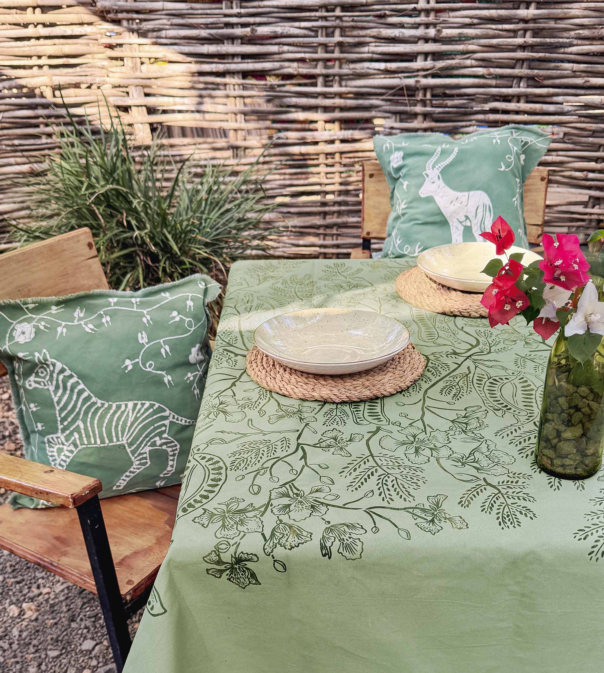 Handmade cotton tablecloth featuring Flamboyant tree-inspired pattern, ethically crafted in Zambia for sustainable, eco-friendly home decor and artisan gifting.
