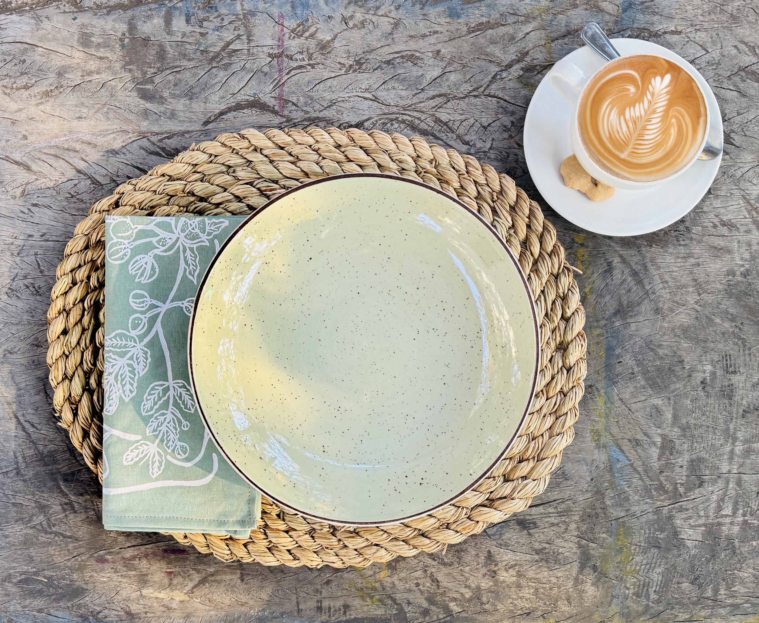 Set of sage green cotton napkins with simple, elegant design, ethically handcrafted in Zambia for sustainable, eco-friendly dining room decor and artisan table settings.

