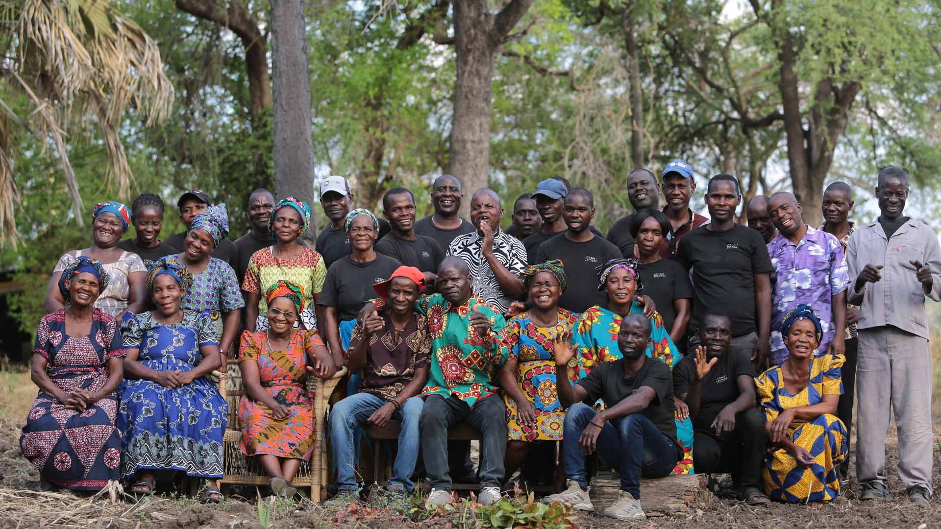 Group photo of vibrant tribal textiles artists