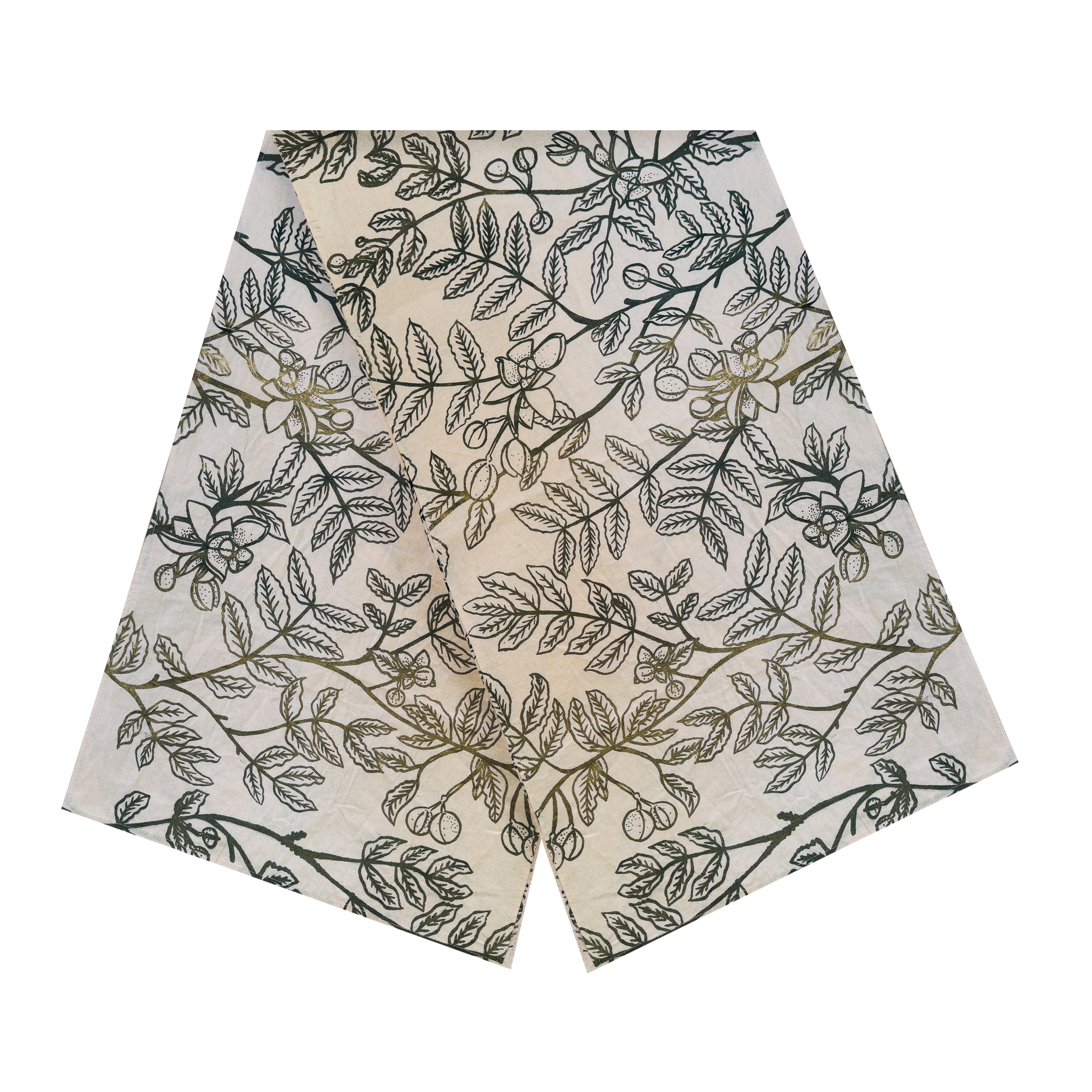 Raw cotton table runner with dark green leaf patterns on natural beige fabric, handmade in Zambia for sustainable, ethical, and eco-friendly home decor and artisan interiors.