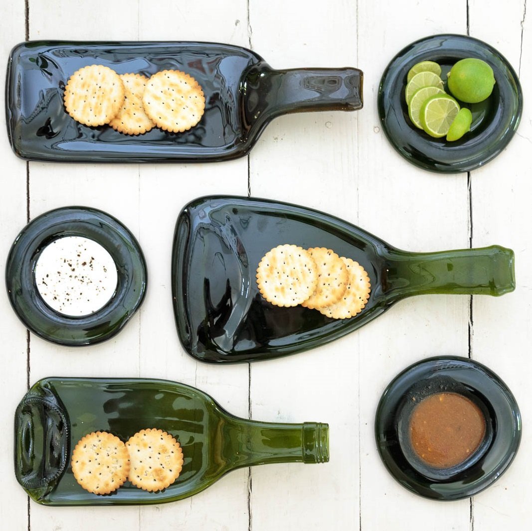 Elegant green glass platters, made from 100% recycled glass and perfect for wowing guests in sustainable style.